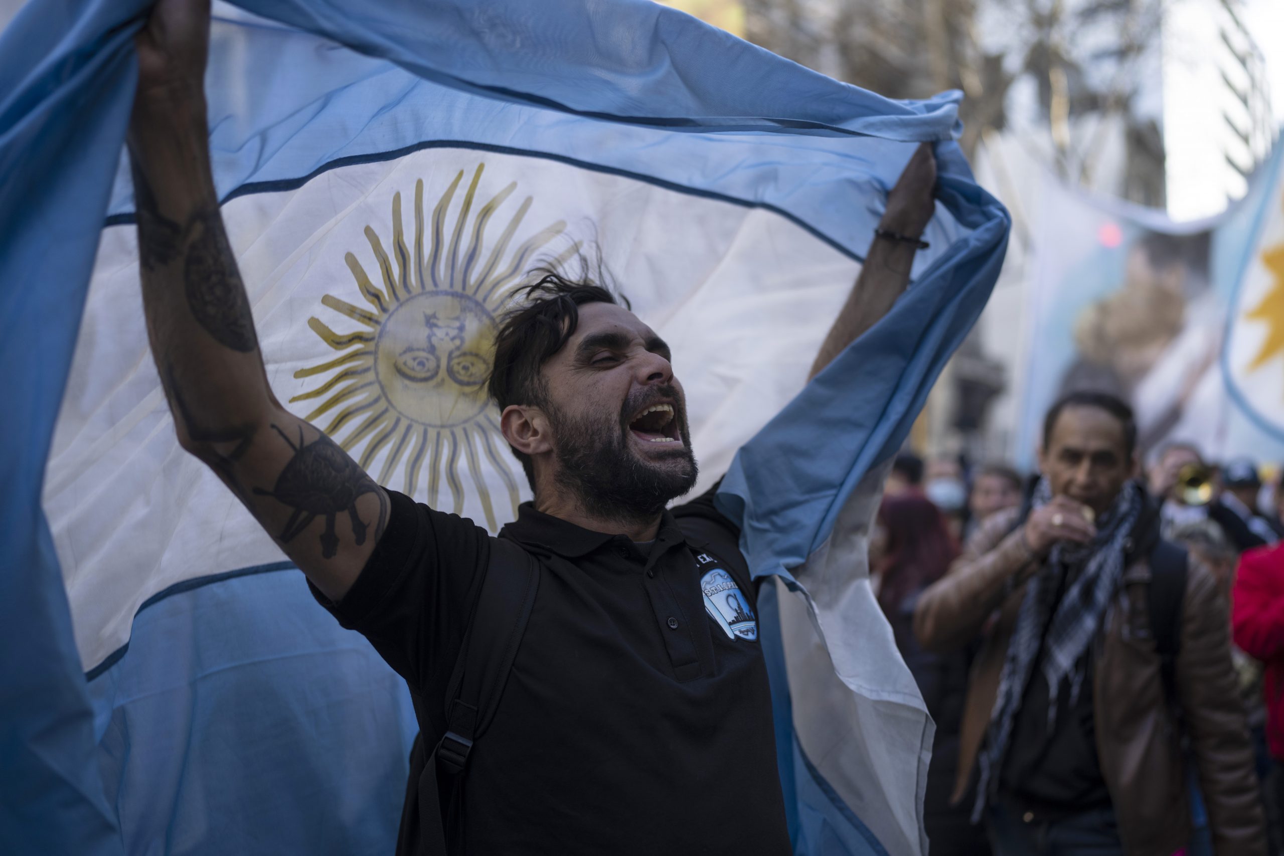 Supporters of Argentine Vice President Cristina Fernandez gather in Plaza de Mayo square the day after a person pointed a gun at her outside her home in Buenos Aires, Argentina, Friday, Sept. 2, 2022. (AP Photo/Rodrigo Abd)