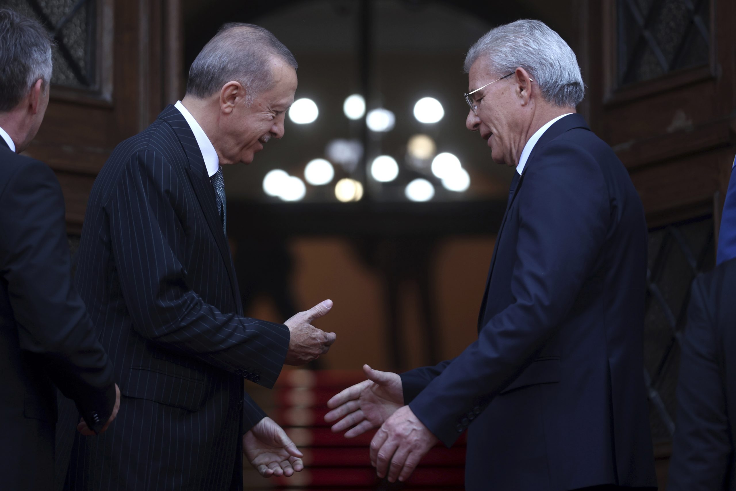 Turkey's President Recep Tayyip Erdogan, left, and the chairman of the tripartite Presidency of Bosnia and Herzegovina Sefik Dzaferovic, shake hands before starting official talks in Bosnia, Tuesday, Sept. 6, 2022. (AP Photo/Armin Durgut)