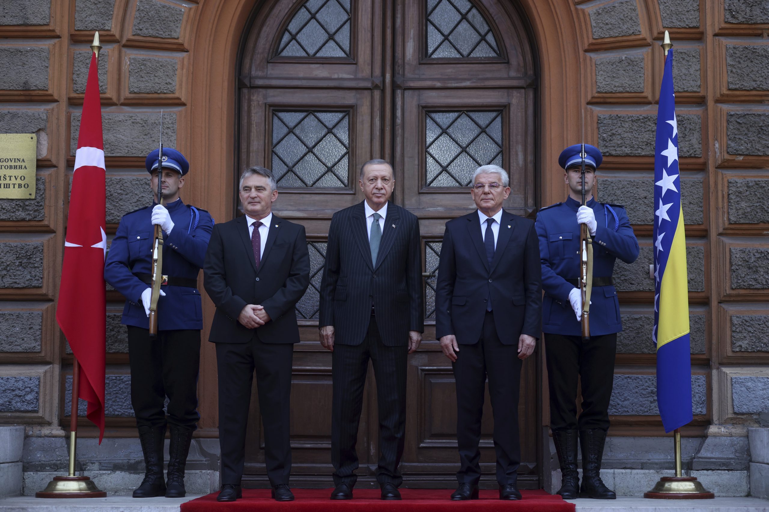 Turkey's President Recep Tayyip Erdogan poses with members of Bosnian presidency Sefik Dzaferovic, right and Zeljko Komsic, left, before official talks in Sarajevo, Bosnia, Tuesday, Sept. 6, 2022. (AP Photo/Armin Durgut)