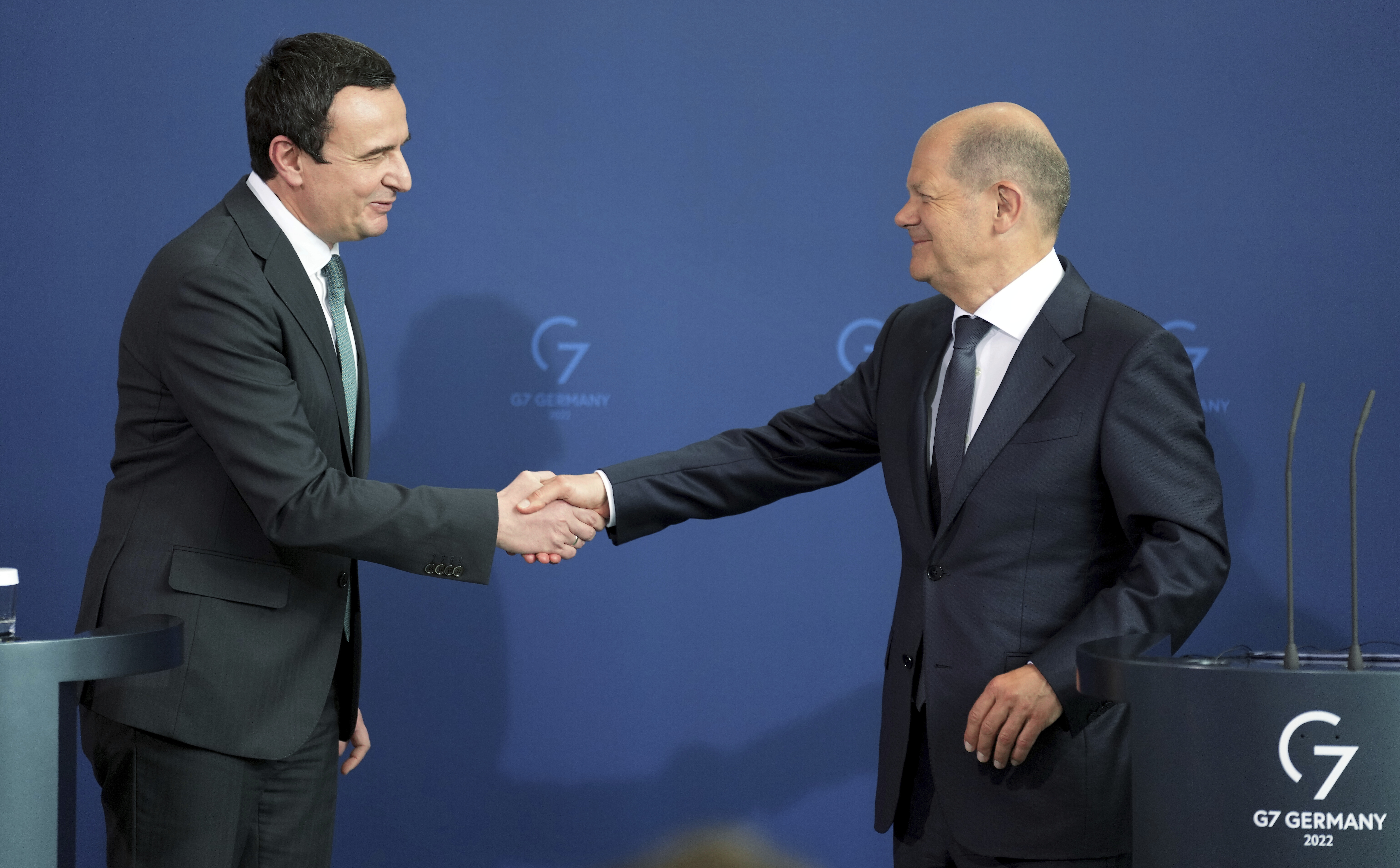 German Chancellor Olaf Scholz, right, and the Prime Minister of Kosovo, Albin Kurti, left, shake hands after a joint press conference as ppart of a meeting at the Chancellery in Berlin, Germany, Wednesday, May 4, 2022. (AP Photo/Michael Sohn)