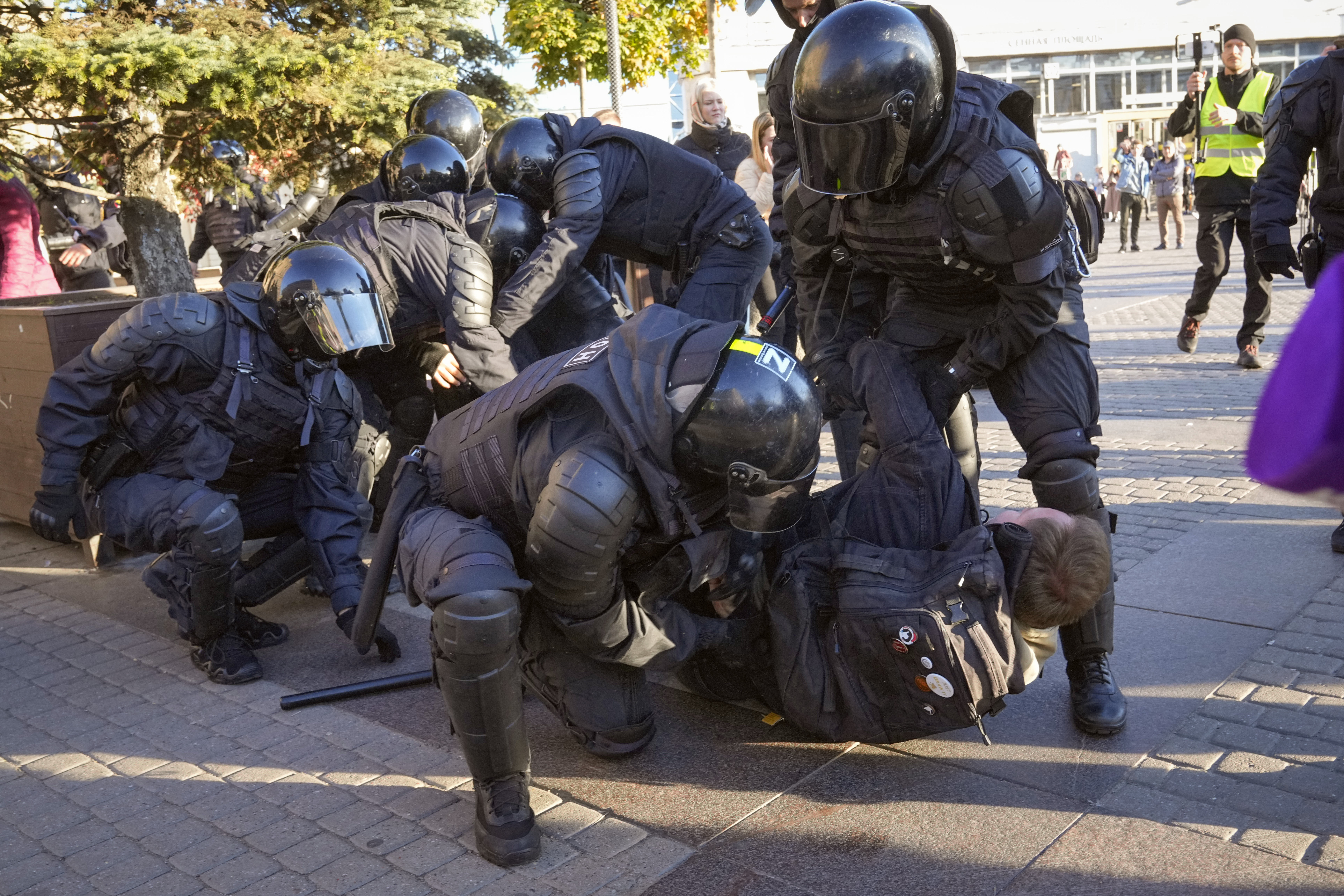 Russian policemen detain demonstrators protesting against mobilization in St. Petersburg, Russia, Saturday, Sept. 24, 2022. (AP Photo)