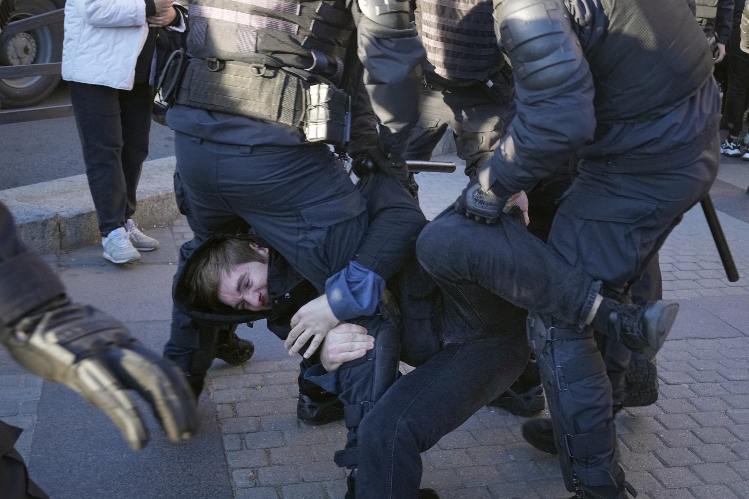 Russian policemen detain a demonstrator protesting against mobilization in St. Petersburg, Russia, Saturday, Sept. 24, 2022. (AP Photo)