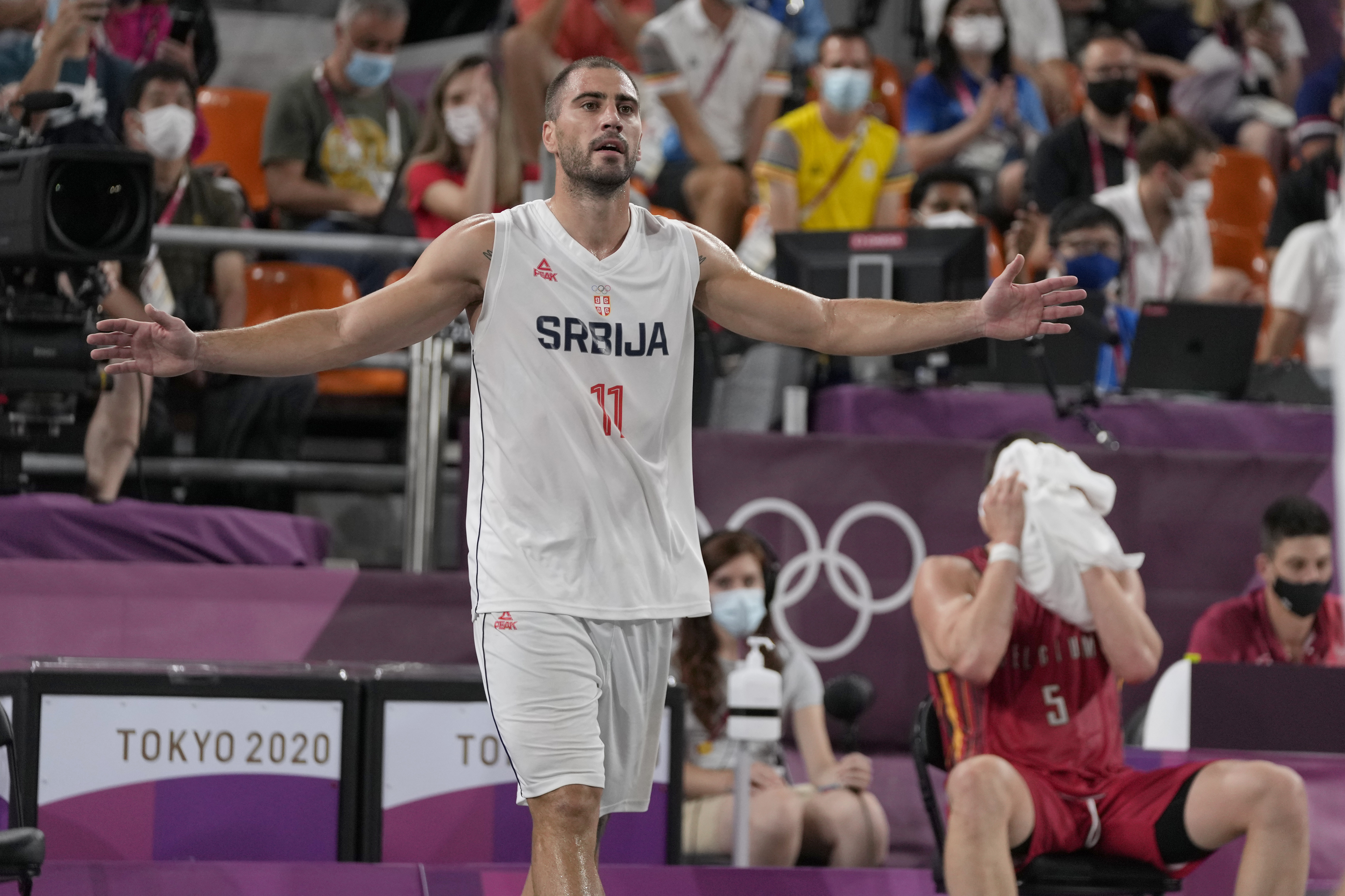 Serbia's Dusan Domovic Bulut celebrates victory as Belgium's Nick Celis (5) covers his face following a men's 3-on-3 bronze medal basketball game at the 2020 Summer Olympics, Wednesday, July 28, 2021, in Tokyo, Japan. (AP Photo/Jeff Roberson)