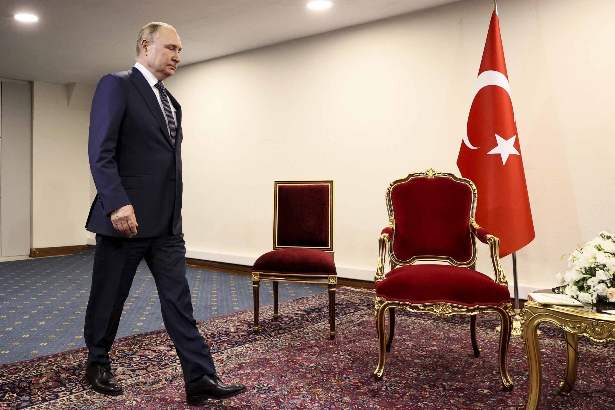 Russian President Vladimir Putin walks to greet Turkish President Recep Tayyip Erdogan prior to their talks at the Saadabad palace, in Tehran, Iran, Tuesday, July 19, 2022. (Sergei Savostyanov, Sputnik, Kremlin Pool Photo via AP)