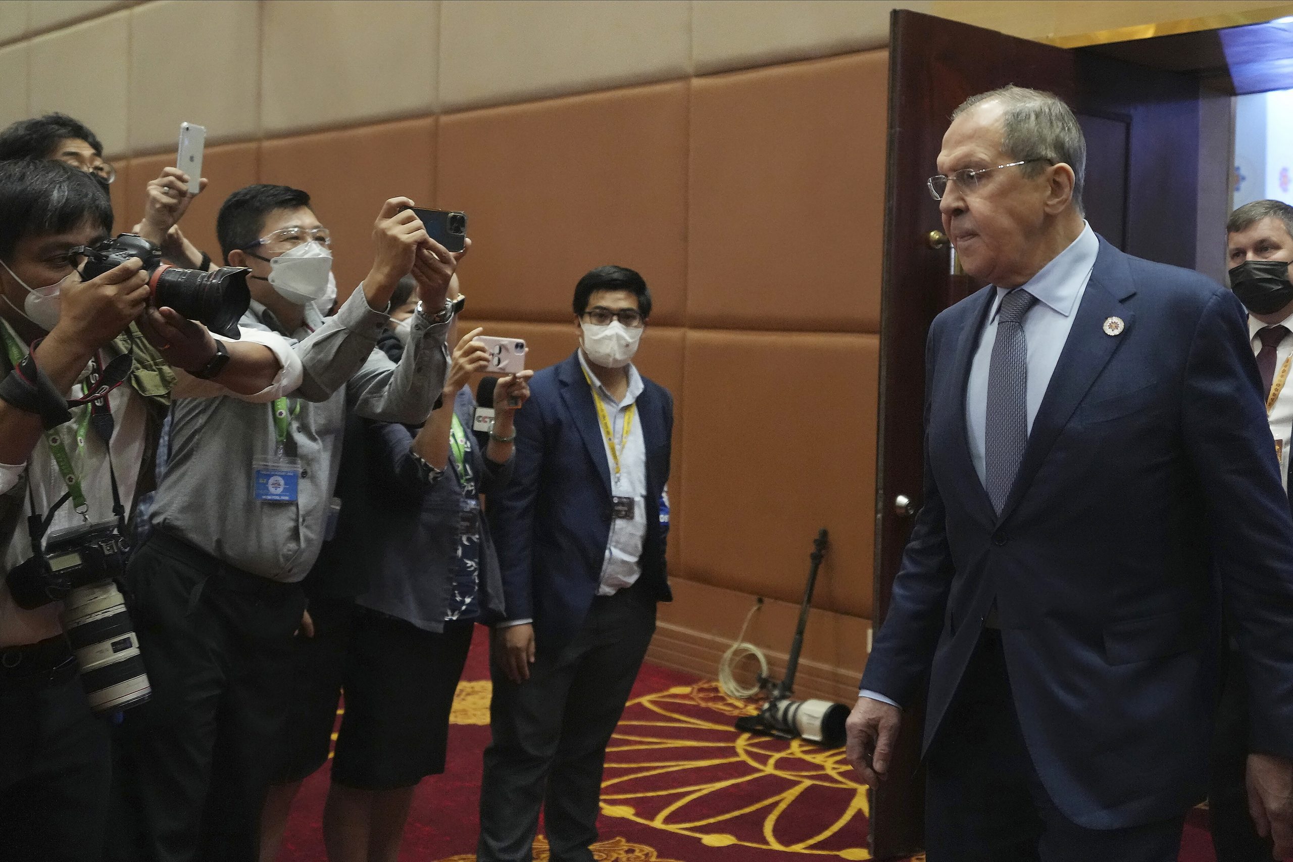 Russian Foreign Minister Sergey Lavrov, right, arrives for the 29th ASEAN Regional Forum in Phnom Penh, Cambodia, Friday, Aug. 5, 2022. (AP Photo/Heng Sinith)