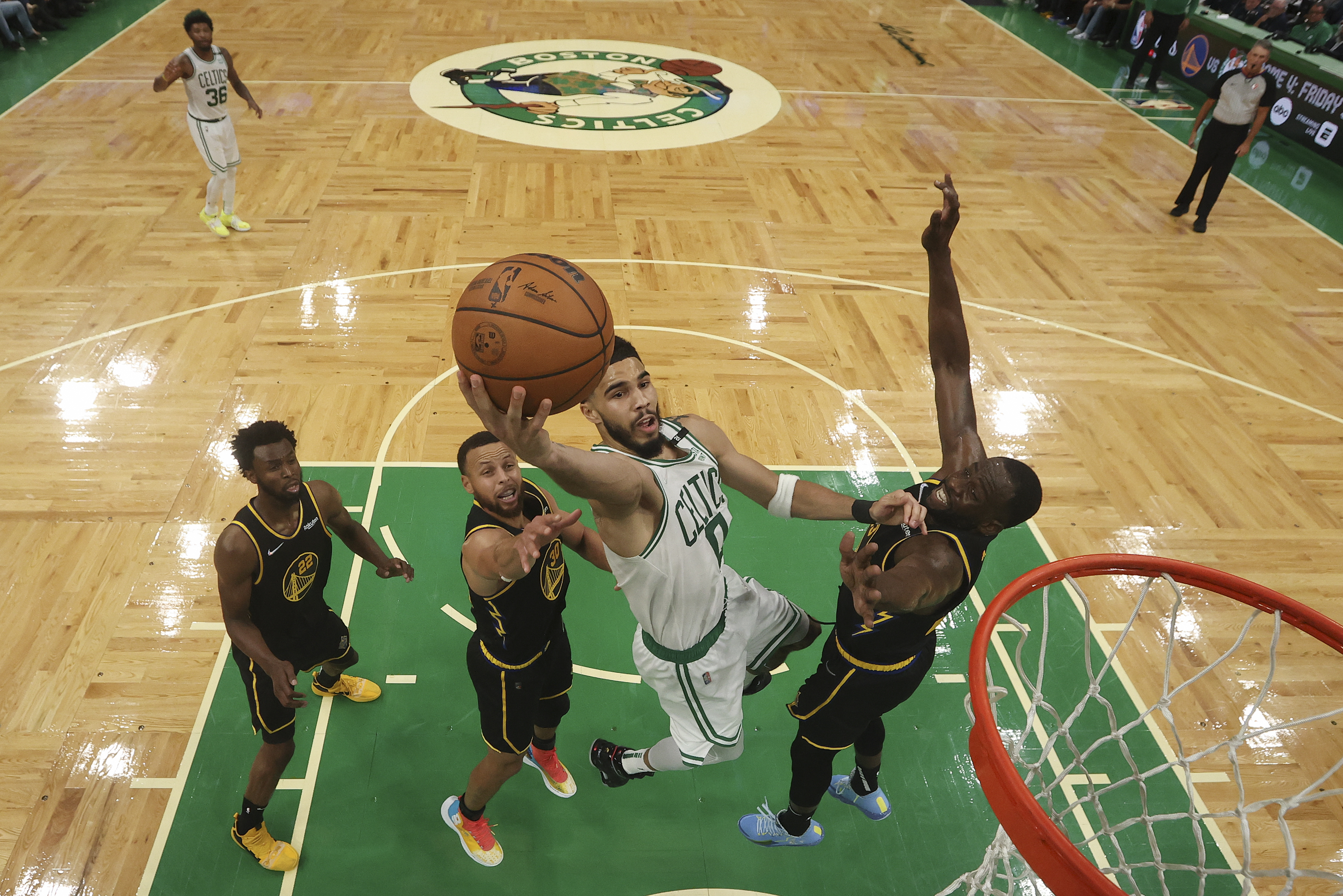 Boston Celtics forward Jayson Tatum (0) puts up a shot against the Golden State Warriors in Game 3 of basketball's NBA Finals, Wednesday, June 8, 2022, in Boston. (Kyle Terada/Pool Photo via AP)