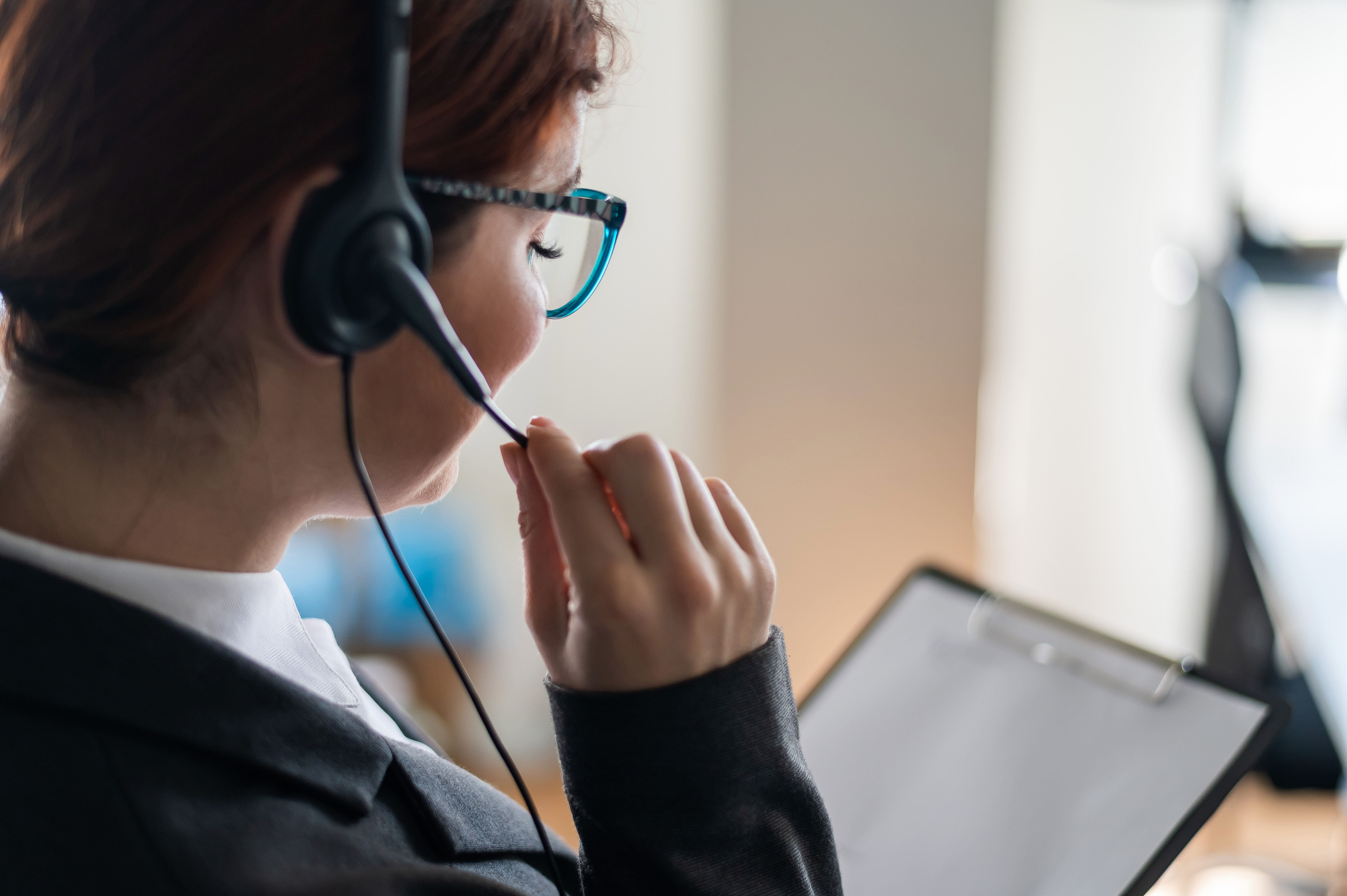 Rear,View,Of,A,Female,Helpdesk,Operator.,An,Office,Manager