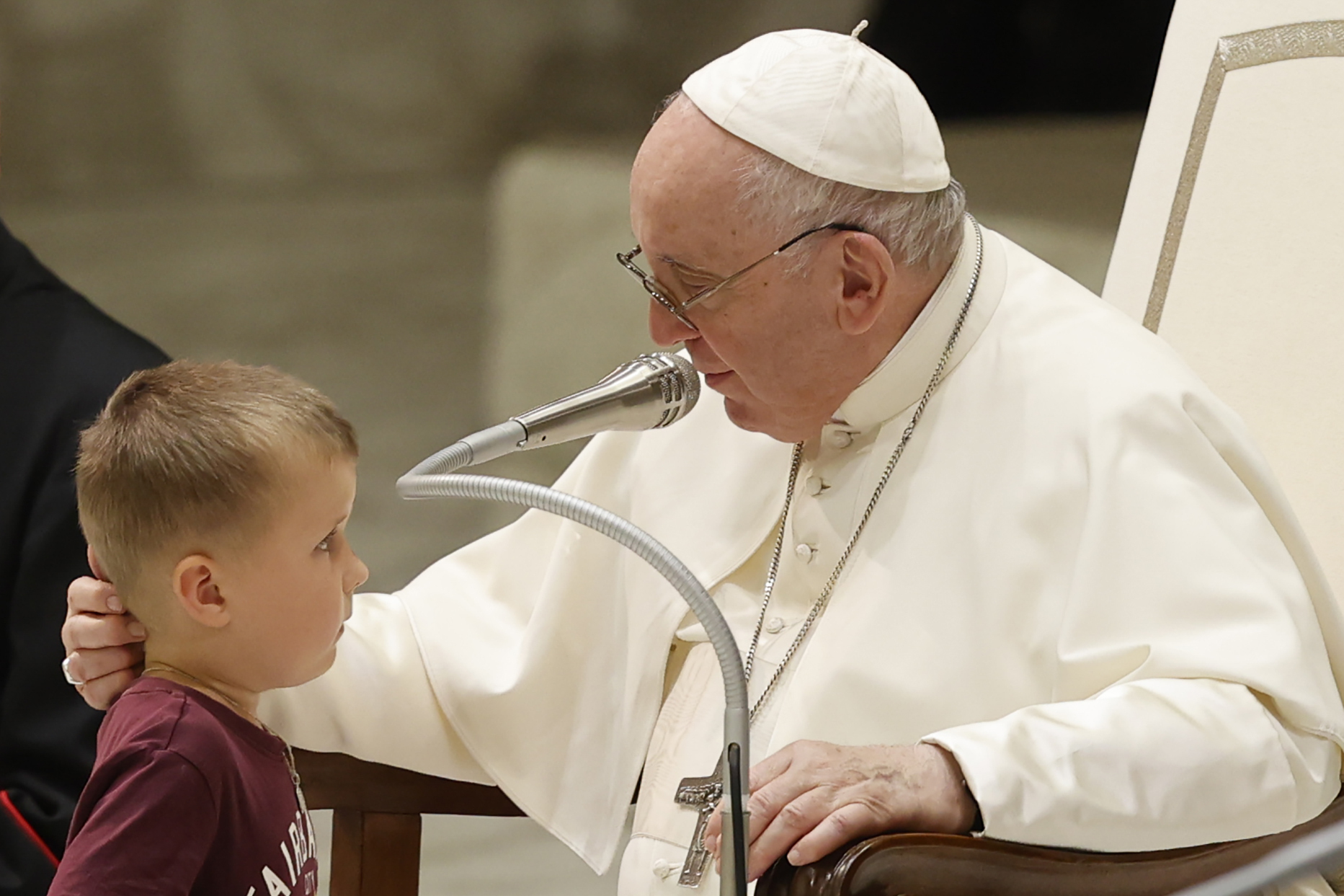 Pope Francis greets a child during his weekly general audience at the Vatican, Wednesday, Aug. 17, 2022. (AP Photo/Riccardo De Luca)