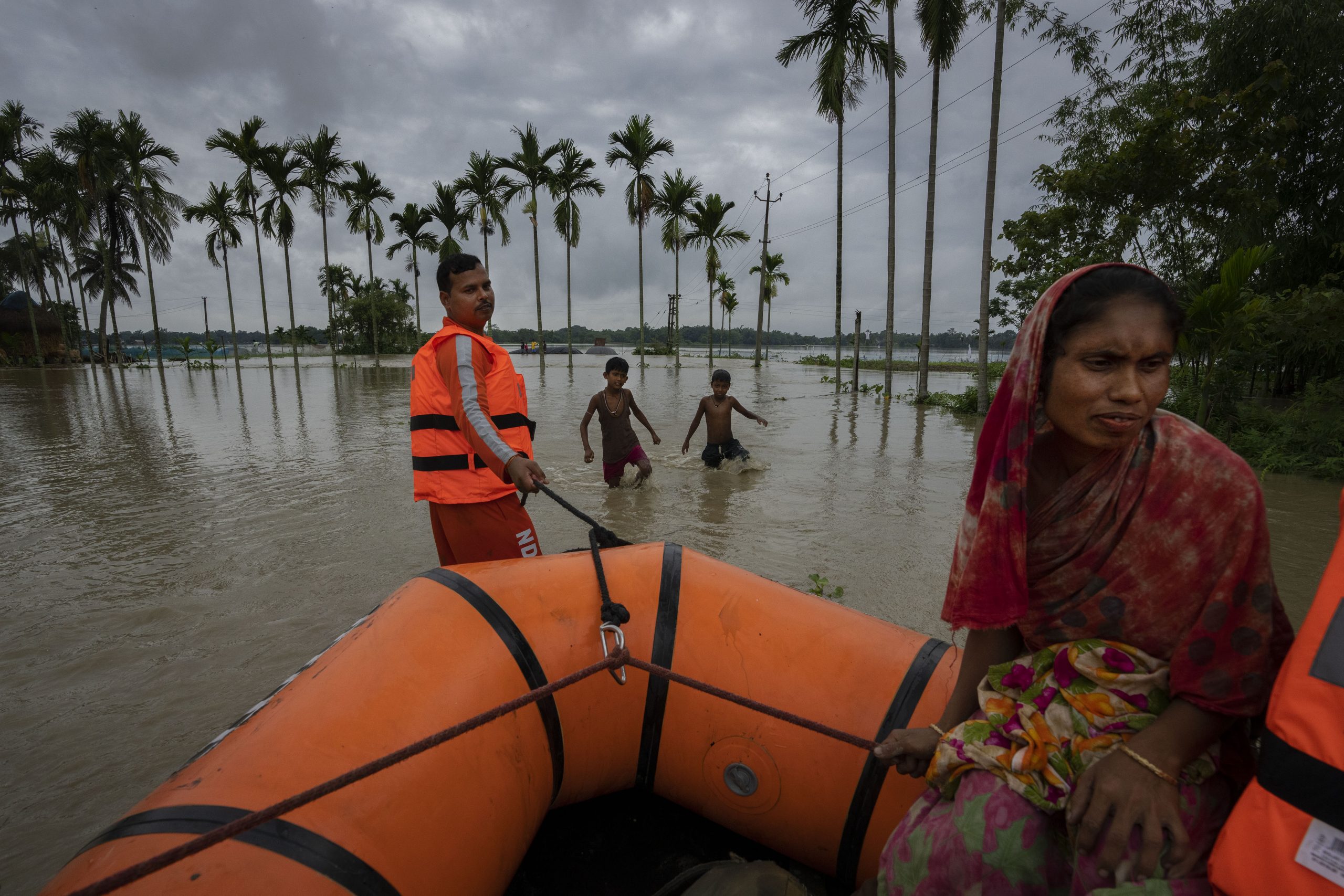 National Disaster Response Force (NDRF) personnel rescue flood-affected villagers in Korora village, west of Gauhati, India, Friday, June 17, 2022. (AP Photo/Anupam Nath)