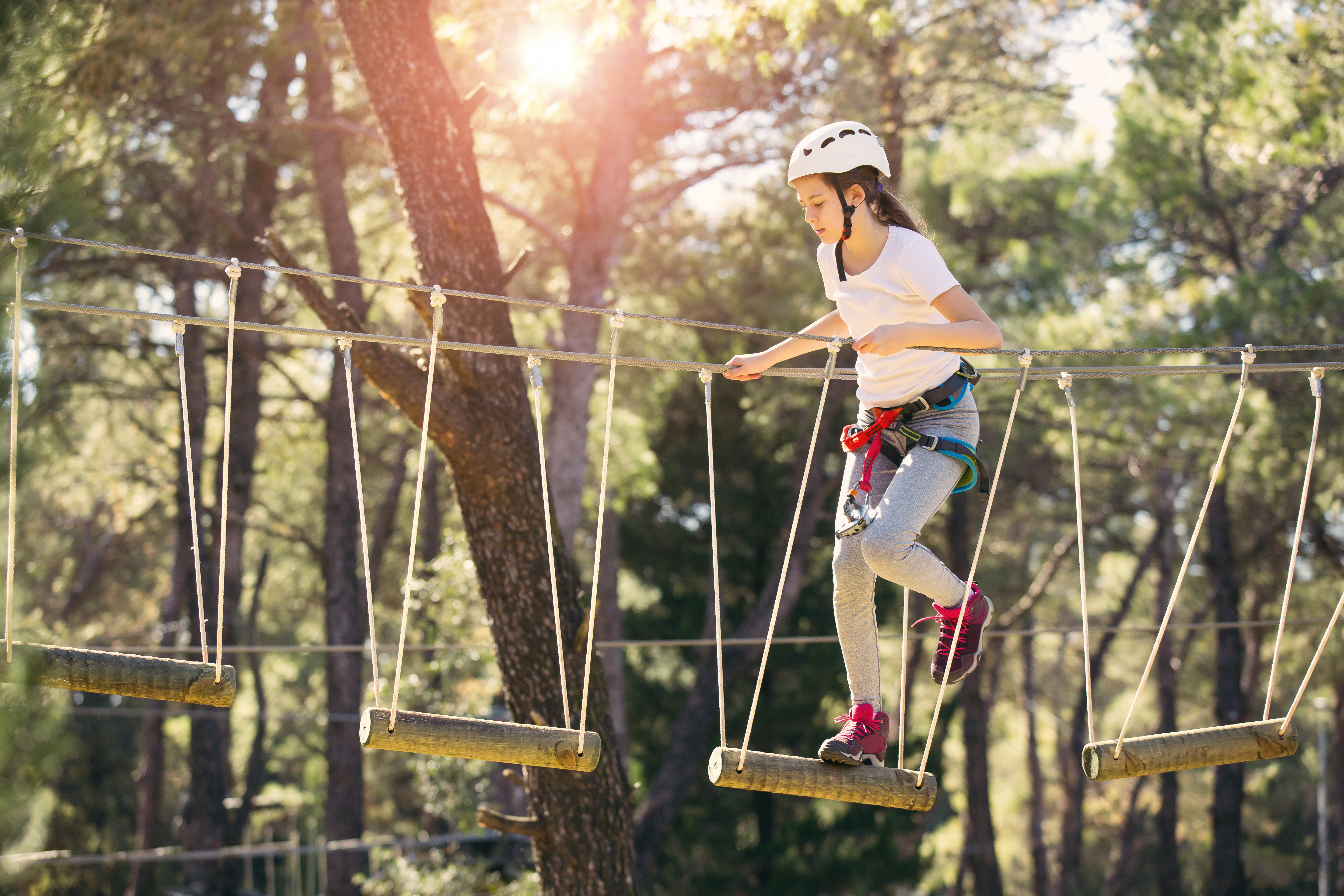 Happy,School,Girl,Enjoying,Activity,In,A,Climbing,Adventure,Park