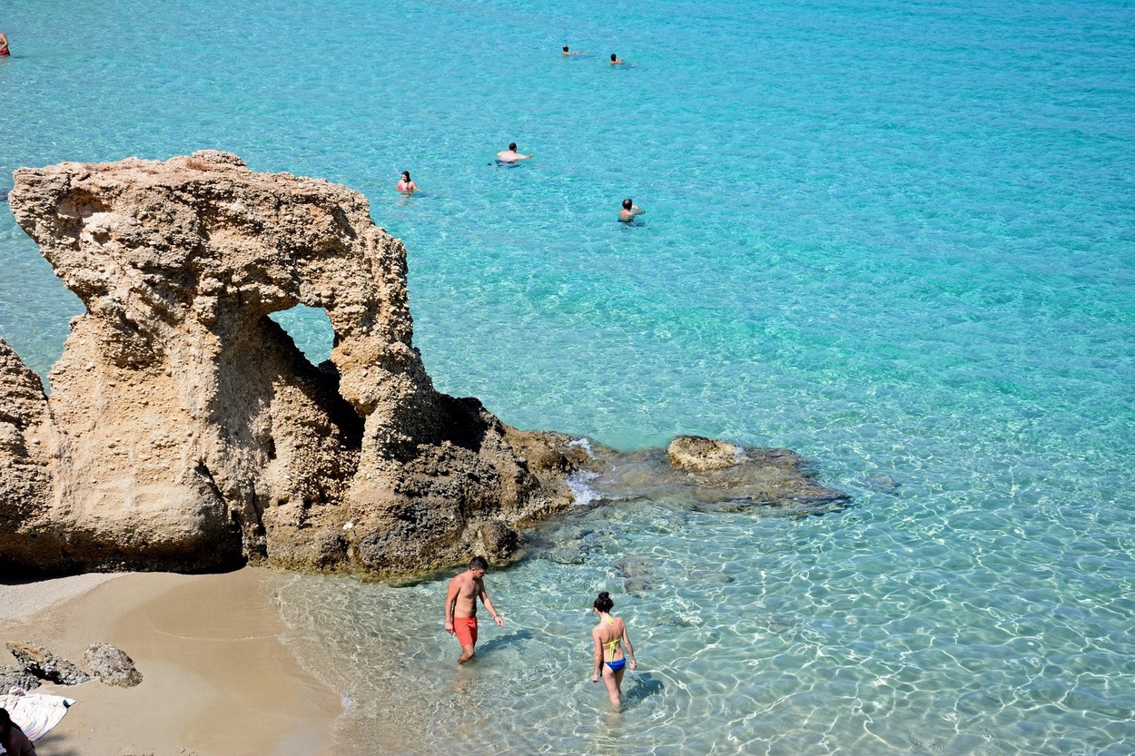 Tourists relaxing on the beach, Istro, Crete, Greece, Europe.