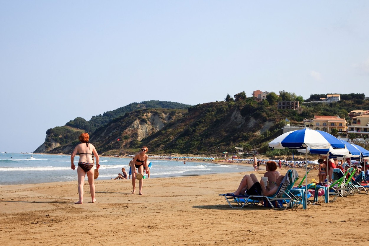 Tourists on the beach at Agios Stephanos, Corfu, Greece,Image: 112856718, License: Rights-managed, Restrictions: , Model Release: no, Credit line: Findlay / Alamy / Profimedia