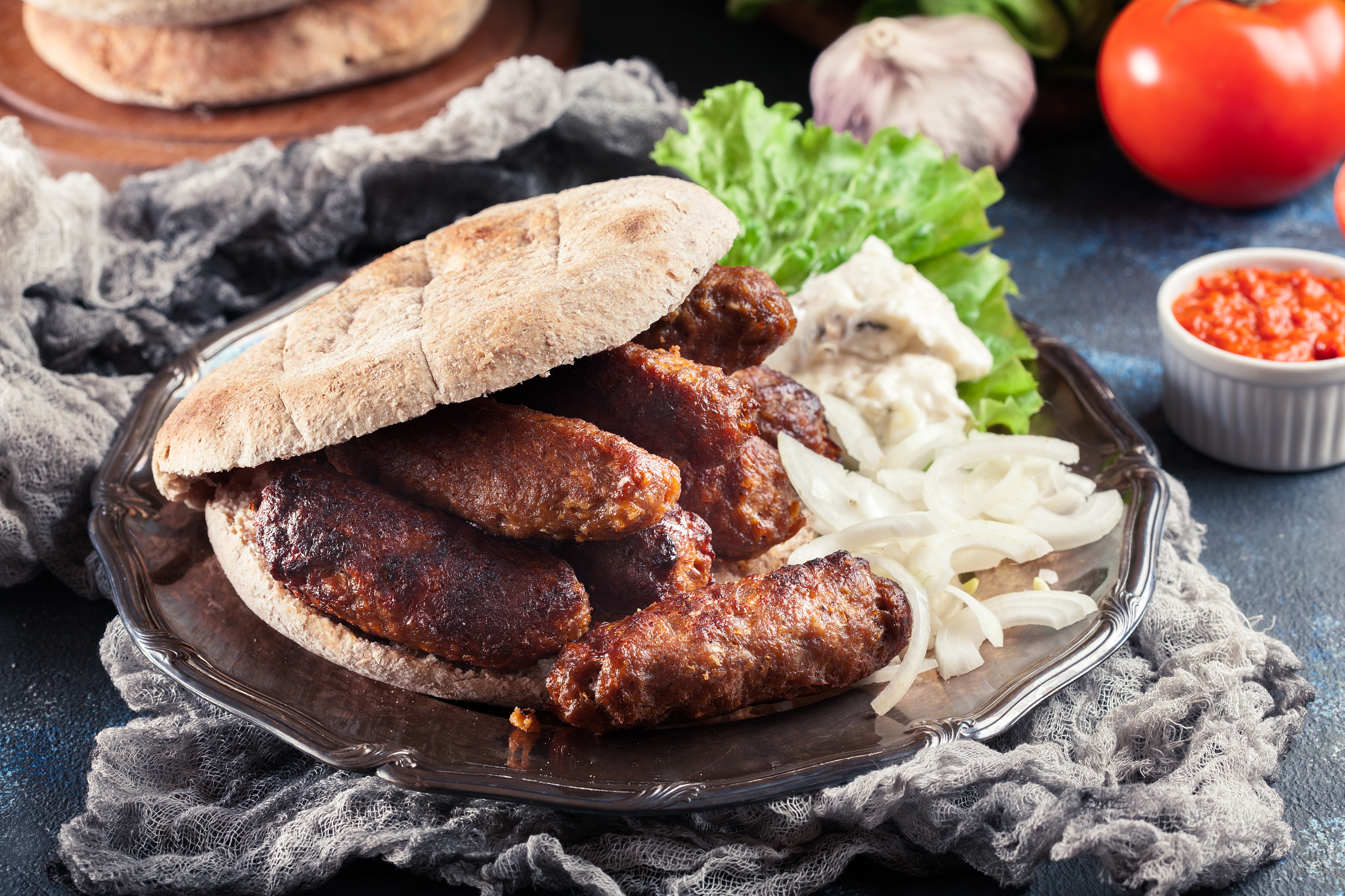 Cevapcici,Or,Cevapi,Served,With,Lepinja,Bread,And,Onion.,Popular