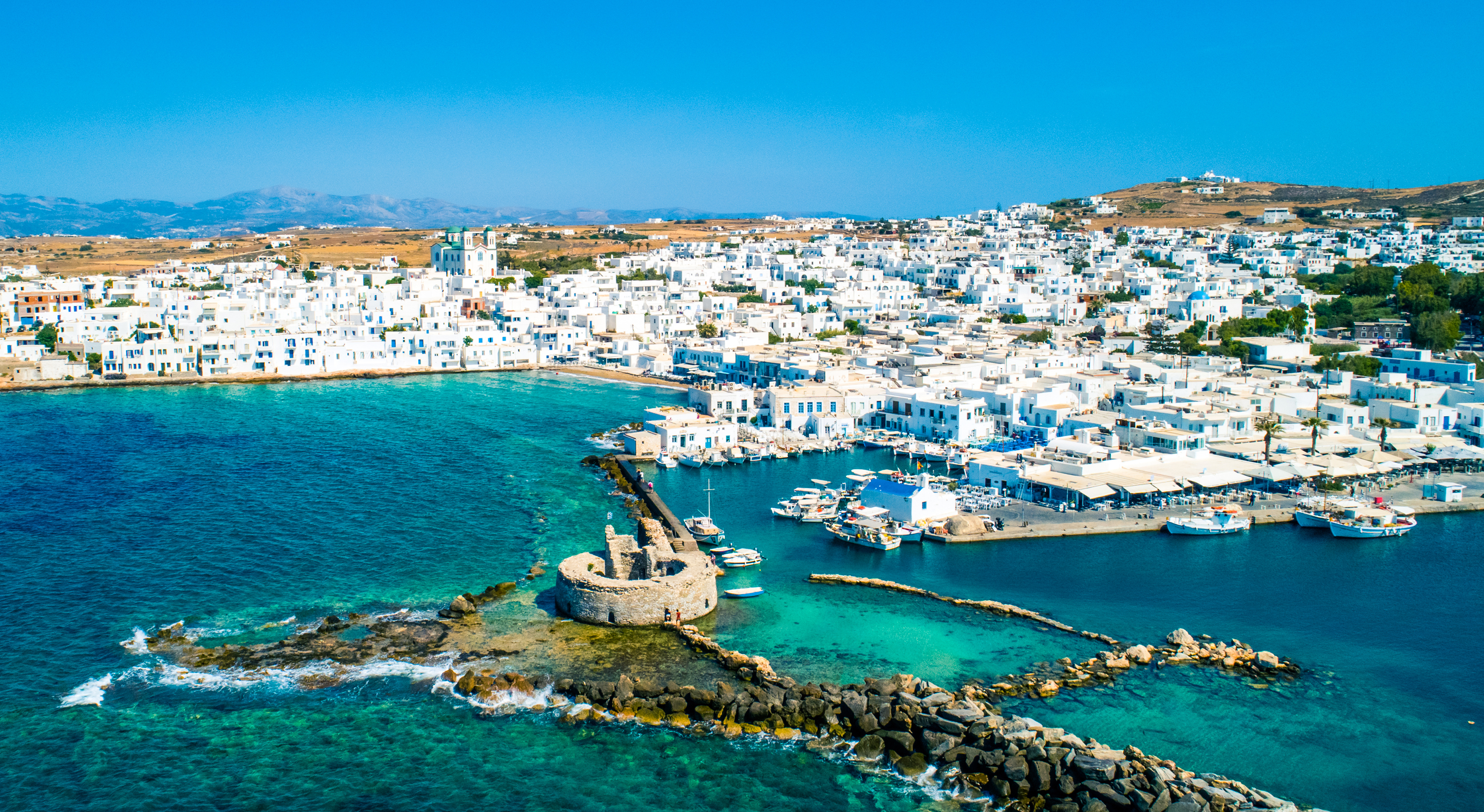Ancient,Ruins,Of,Venetian,Castle,In,The,Harbor,Of,Naoussa