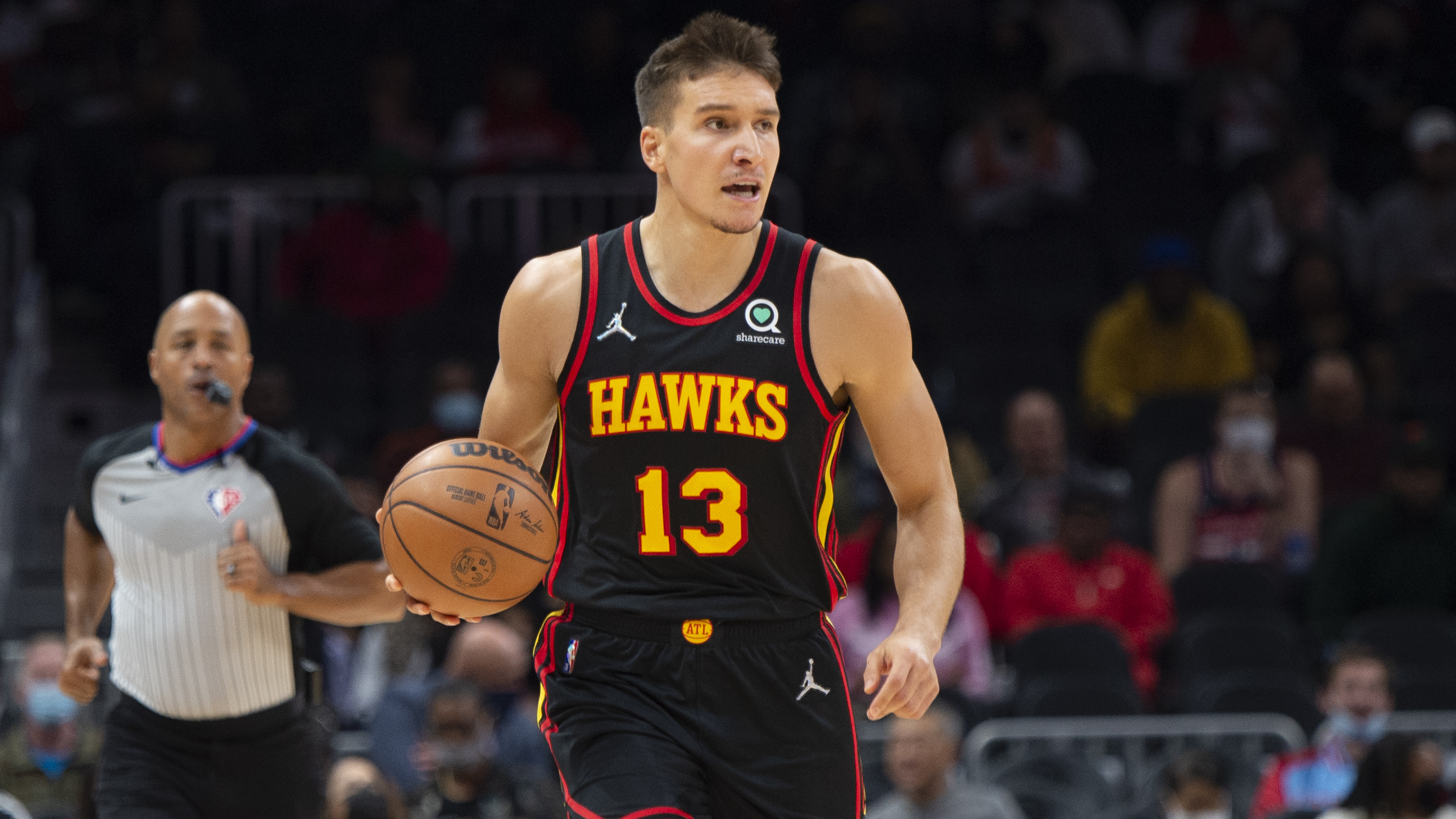 Atlanta Hawks Bogdan Bogdanovic (13) dribbles during the first half of an NBA basketball game against the Washington Wizards on Monday, Nov. 1, 2021, in Atlanta. (AP Photo/Hakim Wright Sr.)