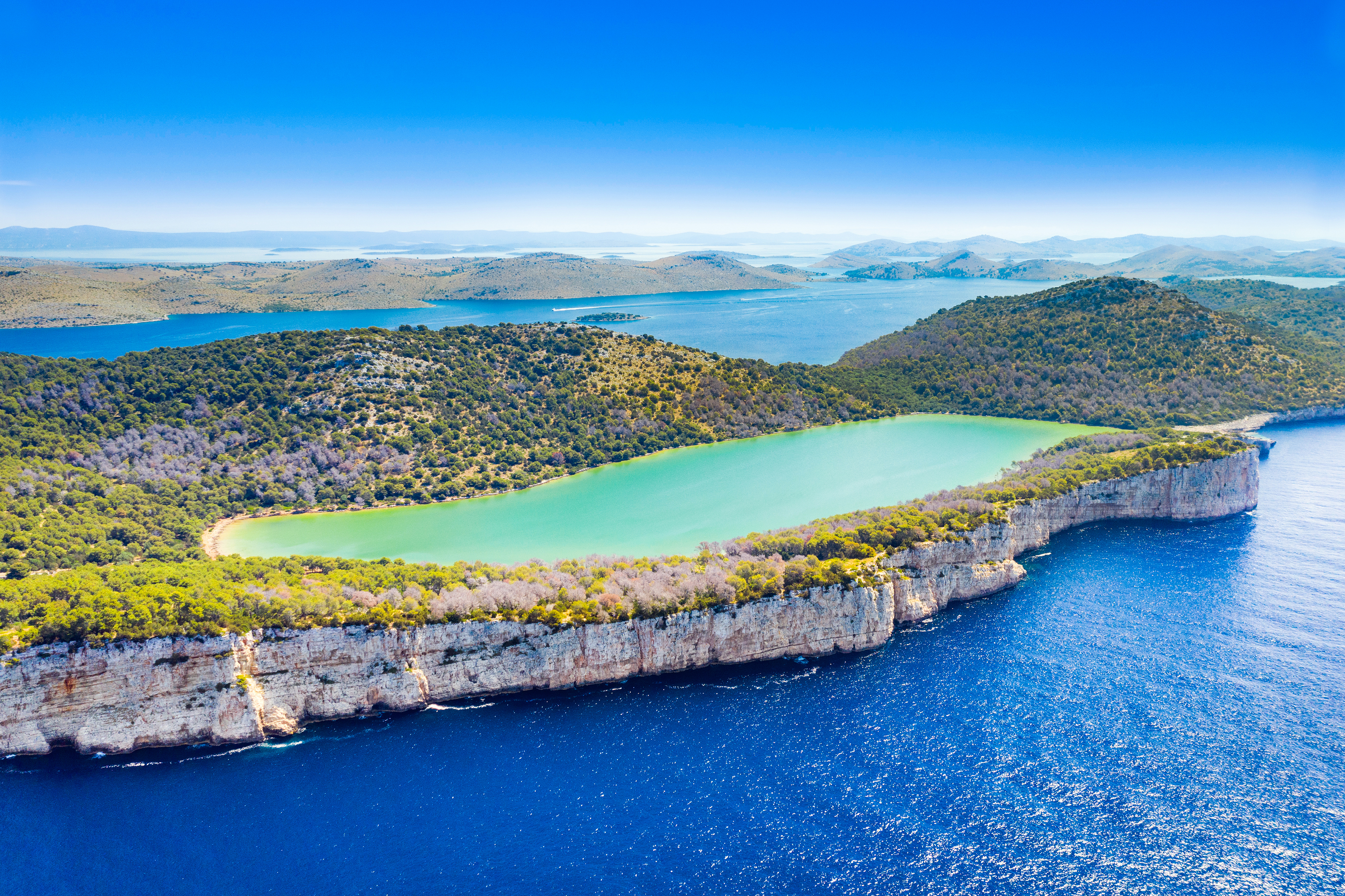 Hrvatska, Croatia, Dugi Otok island, aerial view of the Salty lake in nature park Telascica, spectacular cliffs above the sea shore