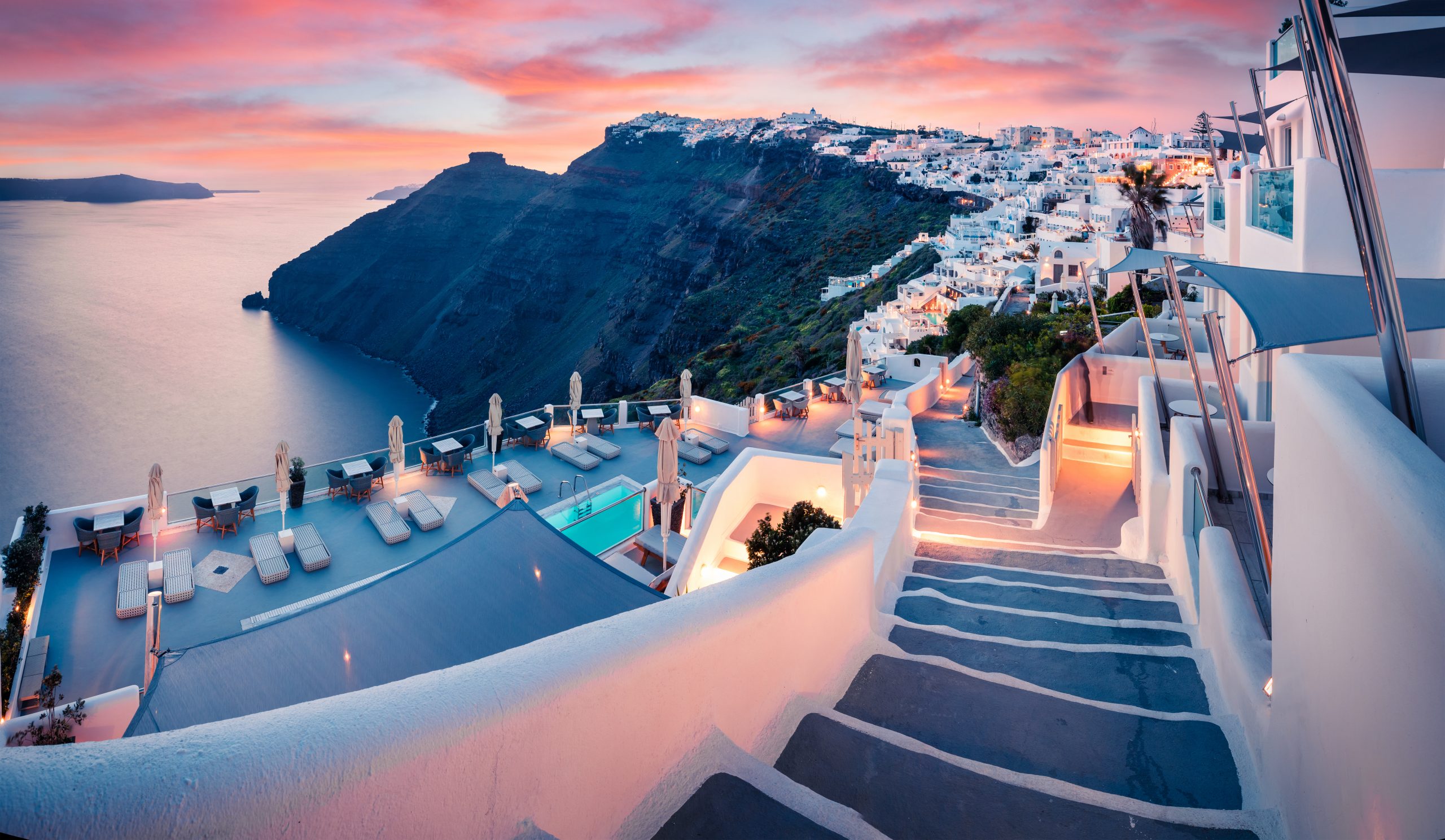 Great evening view of Santorini island. Picturesque spring sunset on the famous Greek resort Fira, Greece, Europe. Traveling concept background. Artistic style post processed photo.