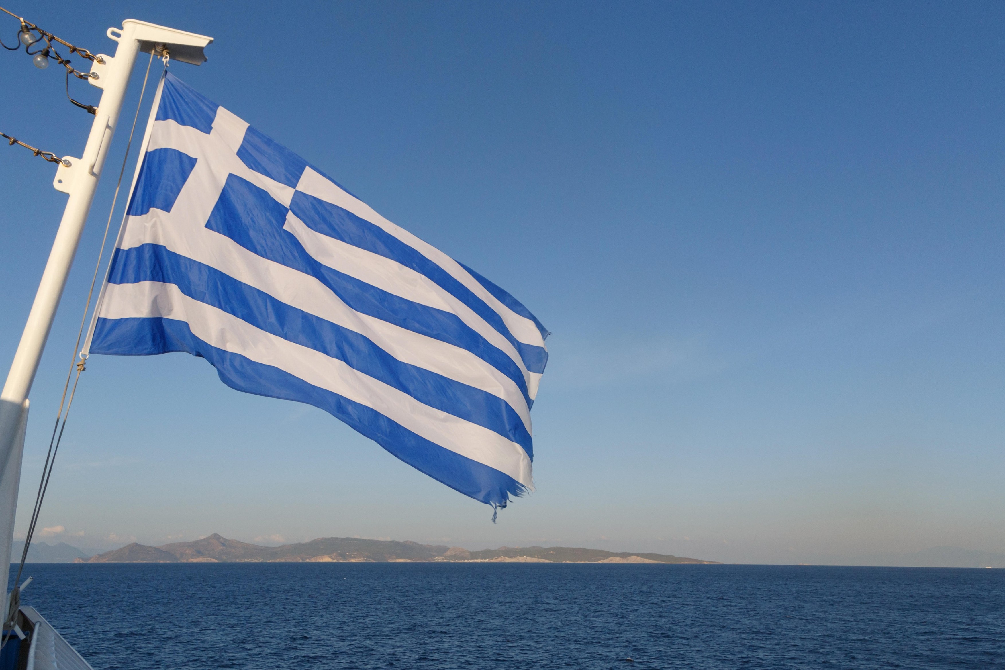 flag of Greece on ferry in Aegean sea