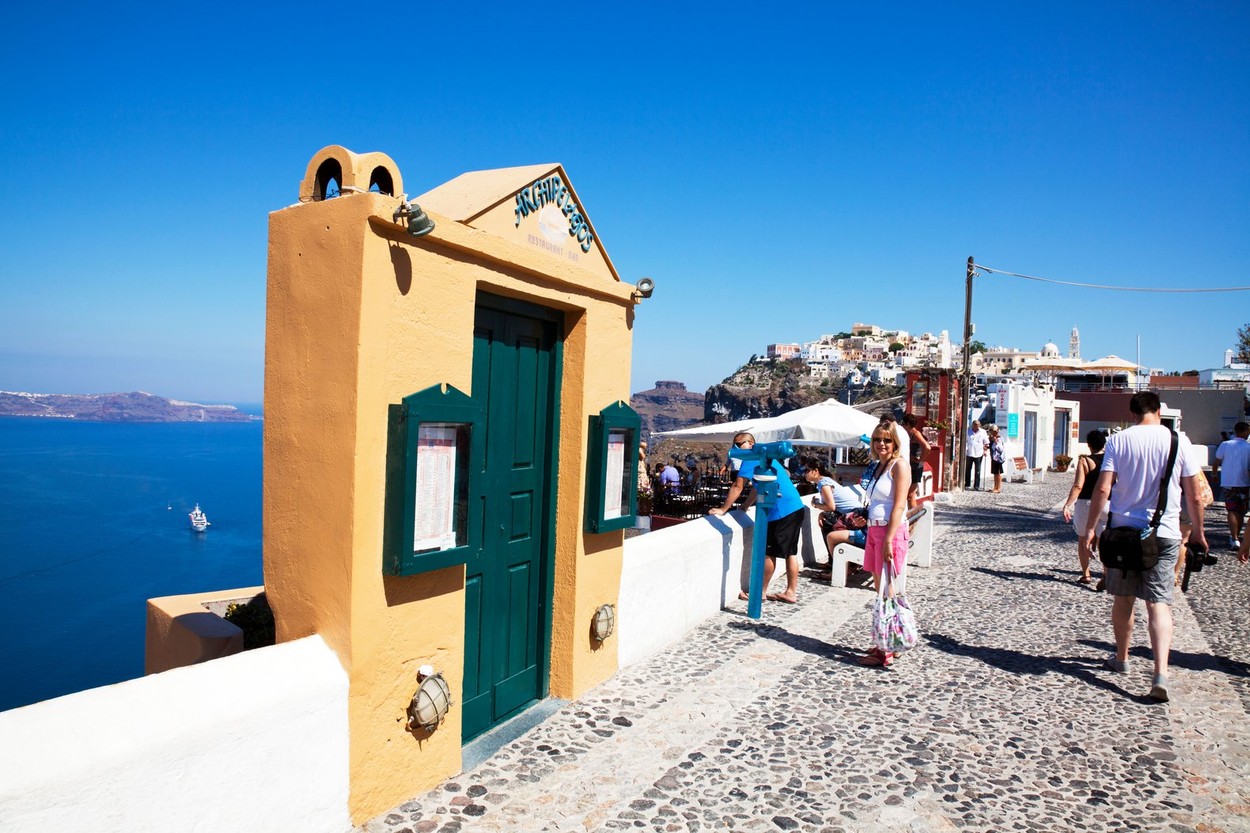 Main Street in Thira Santorini Greek Island, Greece shops restaurants and tourists