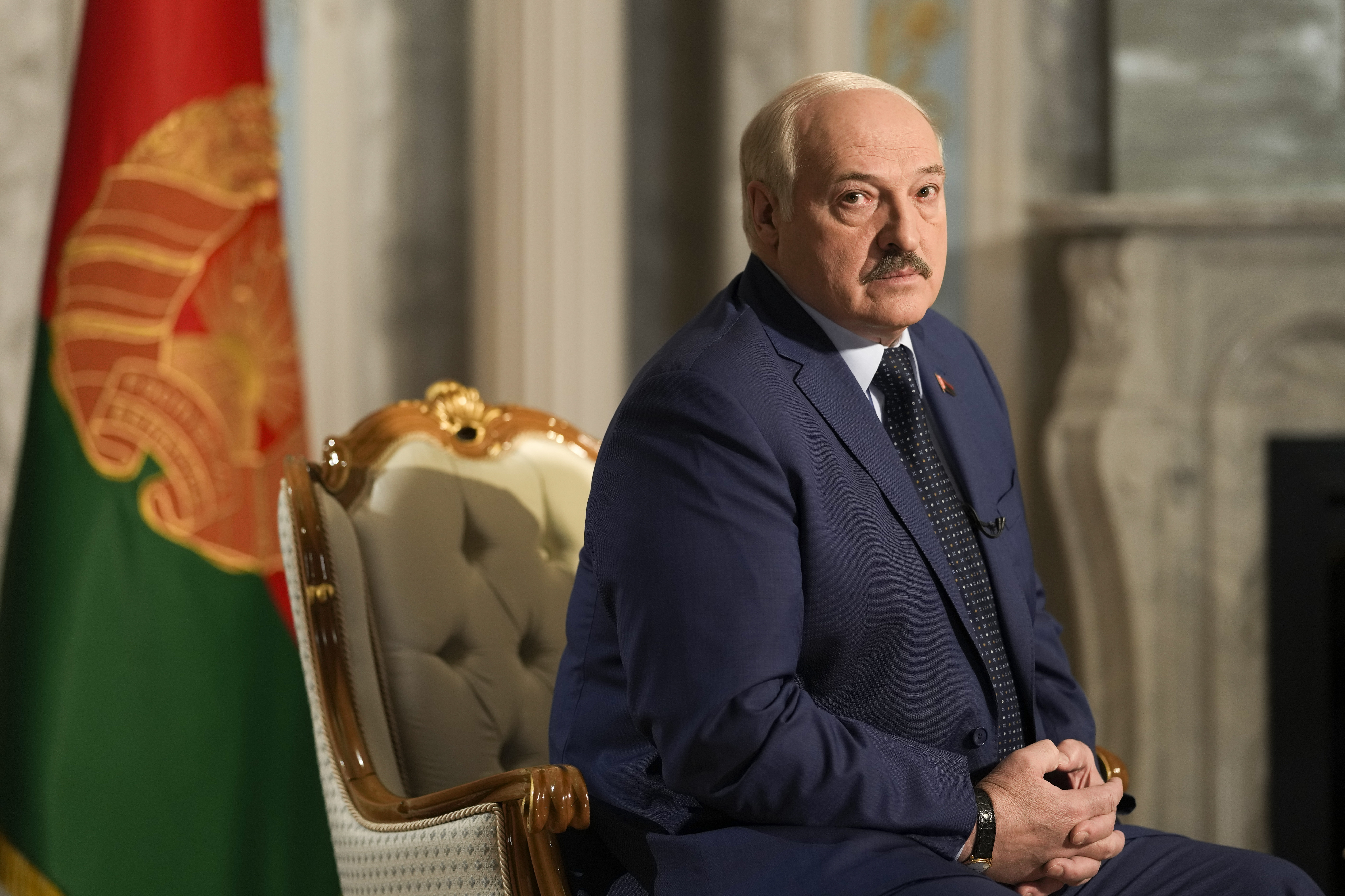 Belarus President Alexander Lukashenko listens to questions during an interview with The Associated Press at the Independence Palace in Minsk, Belarus, Thursday, May 5, 2022. (AP Photo/Markus Schreiber)