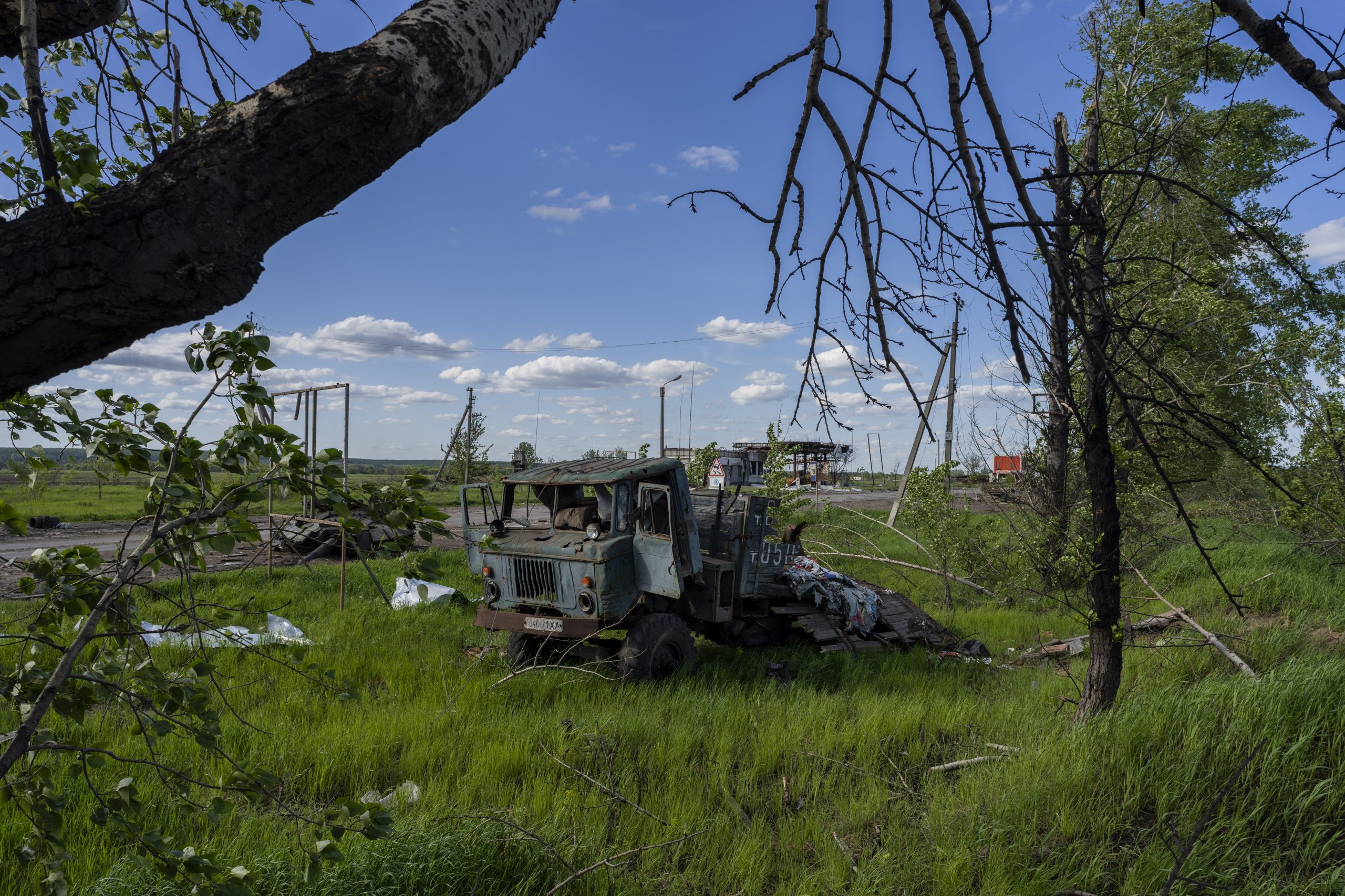 A destroyed truck lies near a road in north Kharkiv, east Ukraine, Friday, May 13, 2022. (AP Photo/Bernat Armangue)