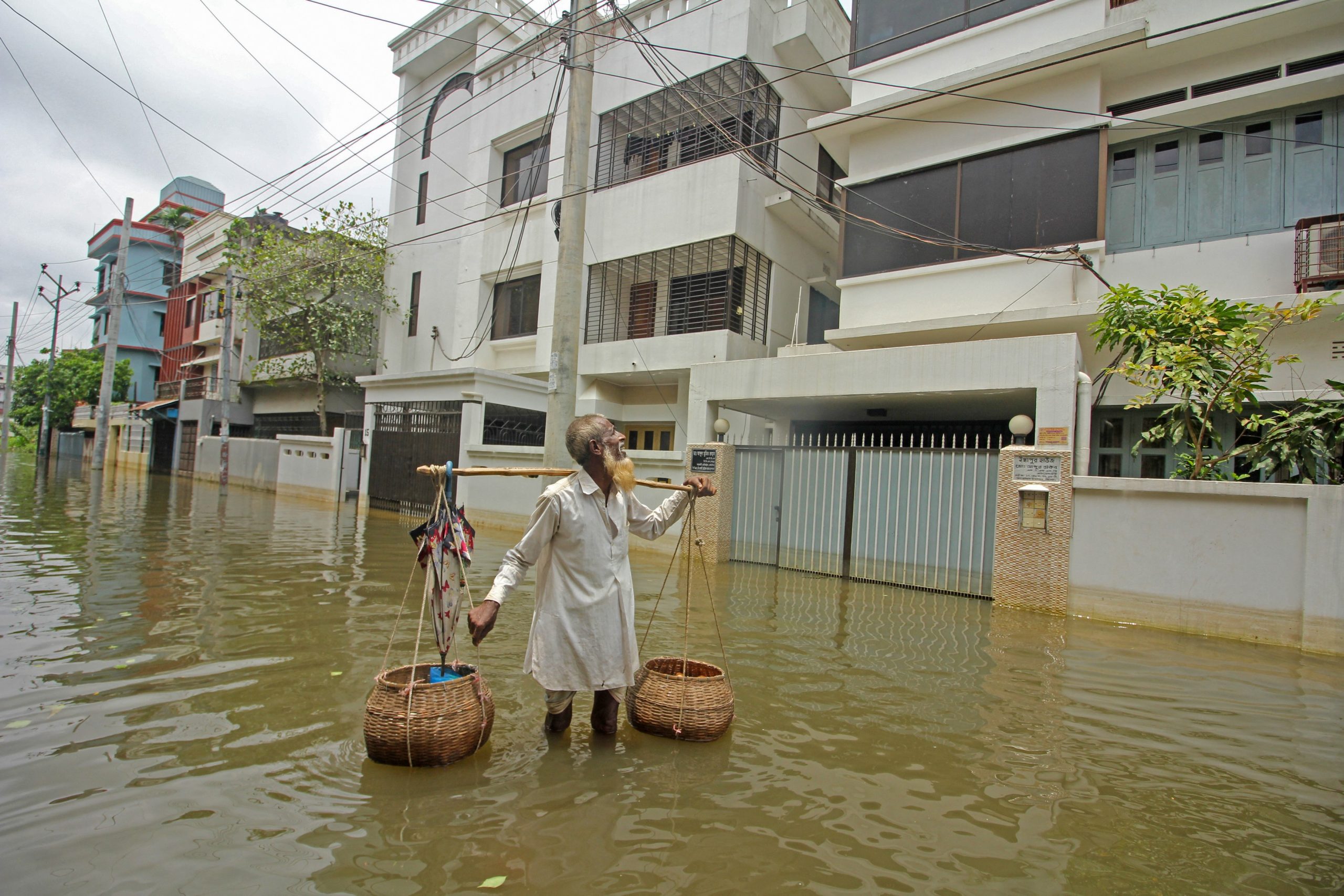 A hawker sells eggs along a flooded street following heavy rains in Sylhet on May 21, 2022.,Image: 693247818, License: Rights-managed, Restrictions: , Model Release: no, Credit line: Mamun Hossain / AFP / Profimedia