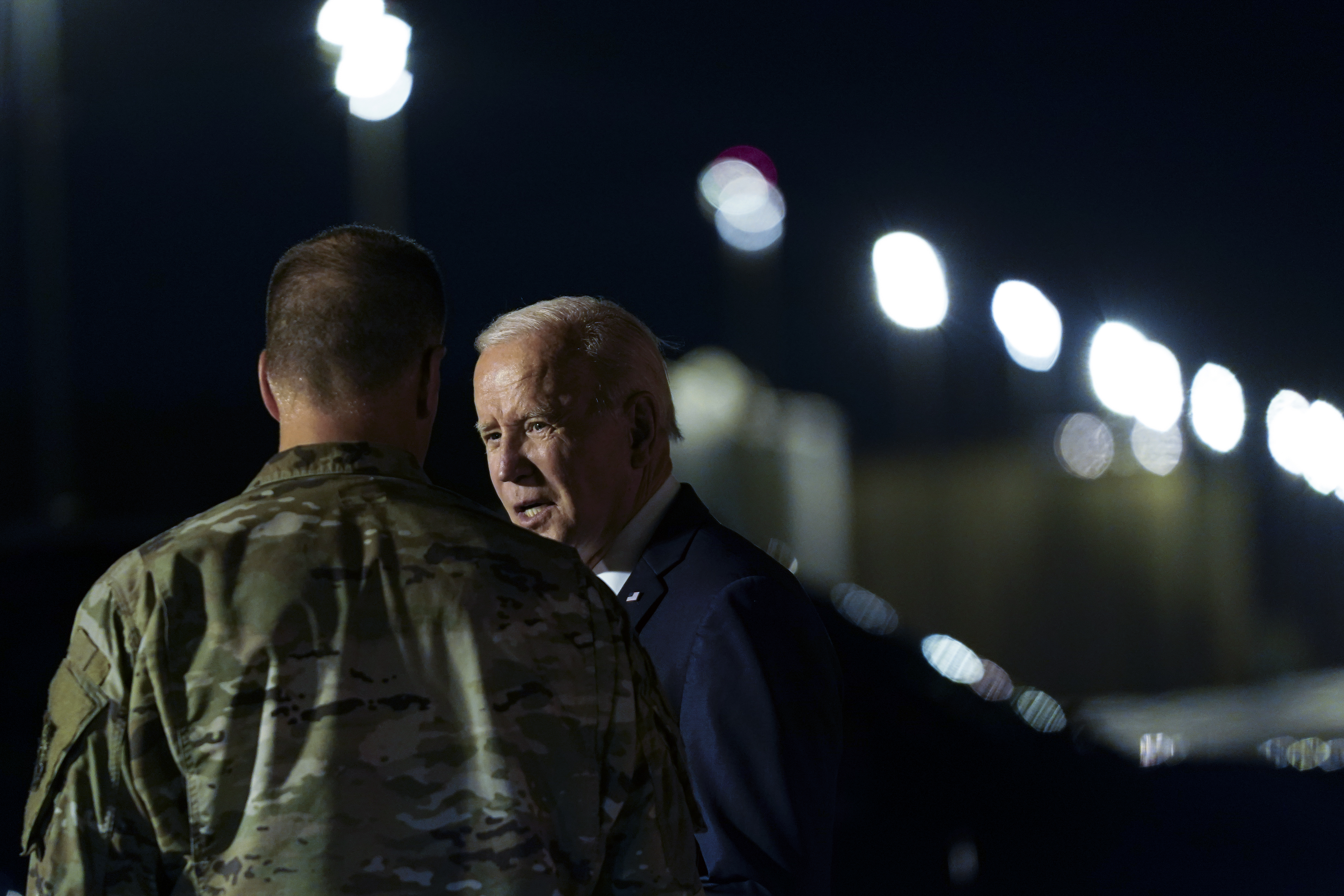 President Joe Biden talks to a member of the military after walking off of Air Force One at Dover Air Force Base, Del., Thursday, June 2, 2022, as he heads to Rehobeth Beach, Del., for the weekend. (AP Photo/Susan Walsh)