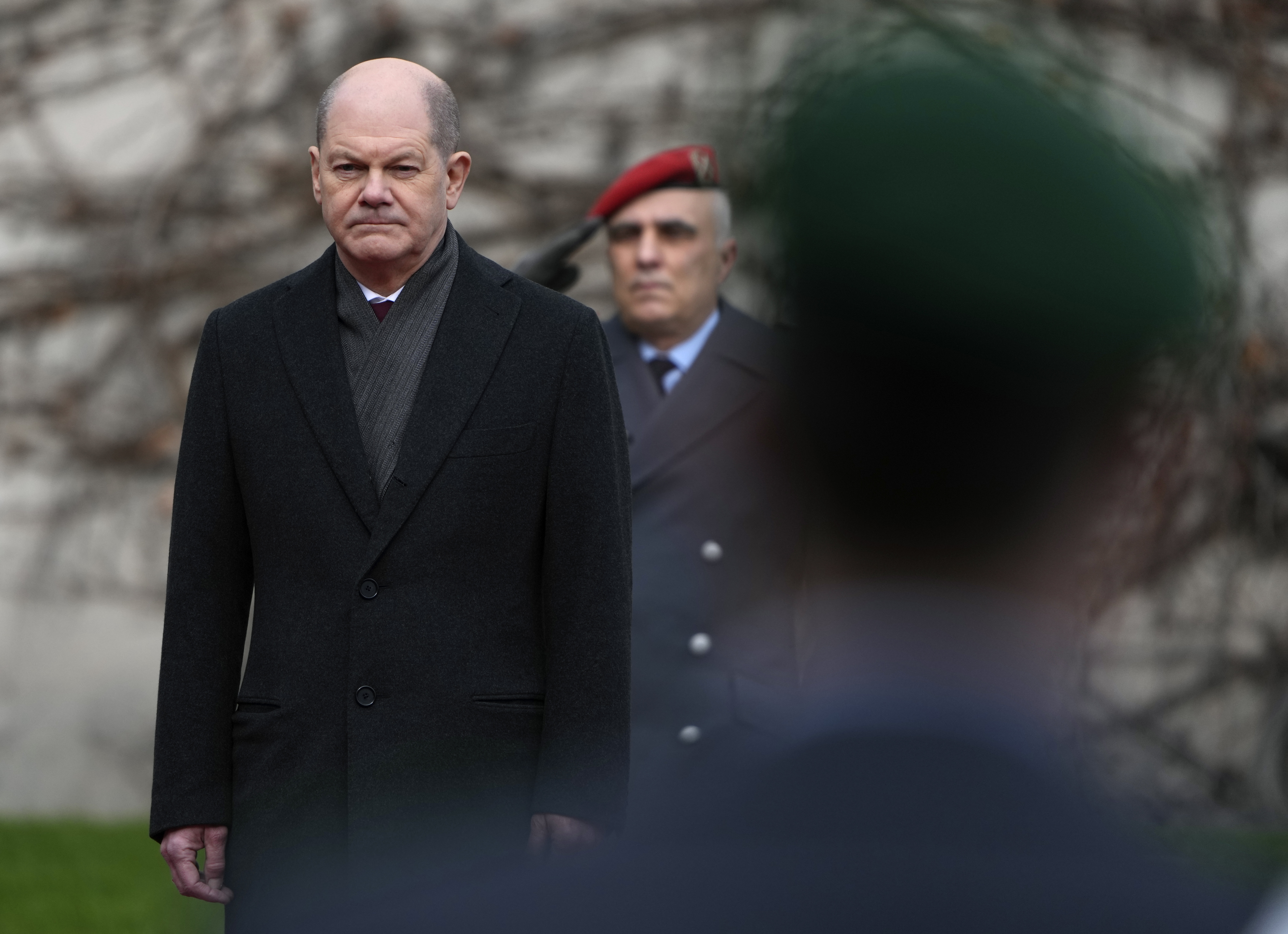 German Chancellor Olaf Scholz waits for Ireland's Prime Minister Micheal Martin at the chancellery in Berlin, Germany, Tuesday, Feb. 22, 2022. (AP Photo/Michael Sohn)