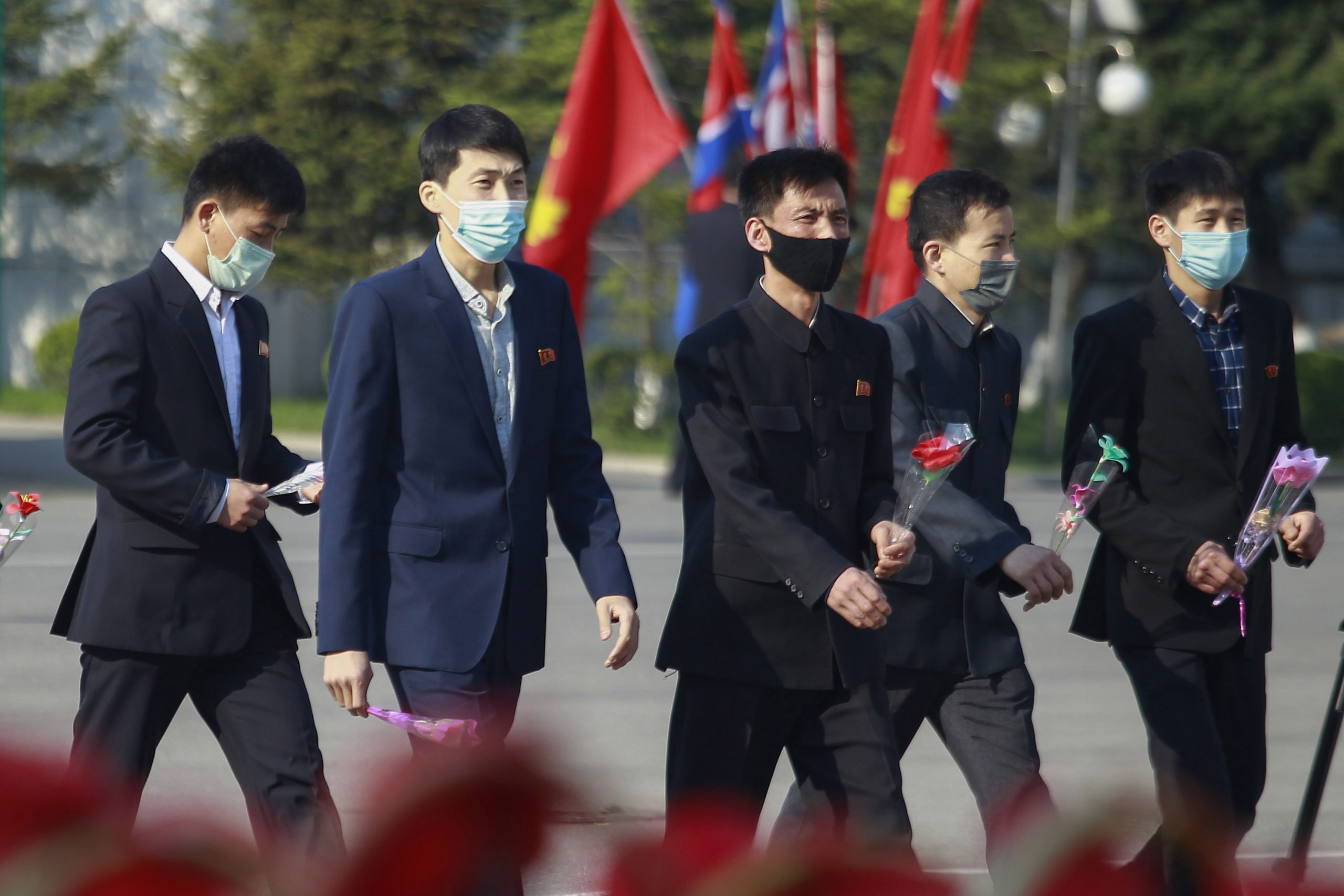 People visit the statues of late North Korean leaders, Kim Il Sung and Kim Jong Il in the Mansudae Art Studio in the celebration of 110th birth anniversary of state founder Kim Il Sung, in Pyongyang, on Friday, April 15, 2022. (AP Photo/Cha Song Ho)