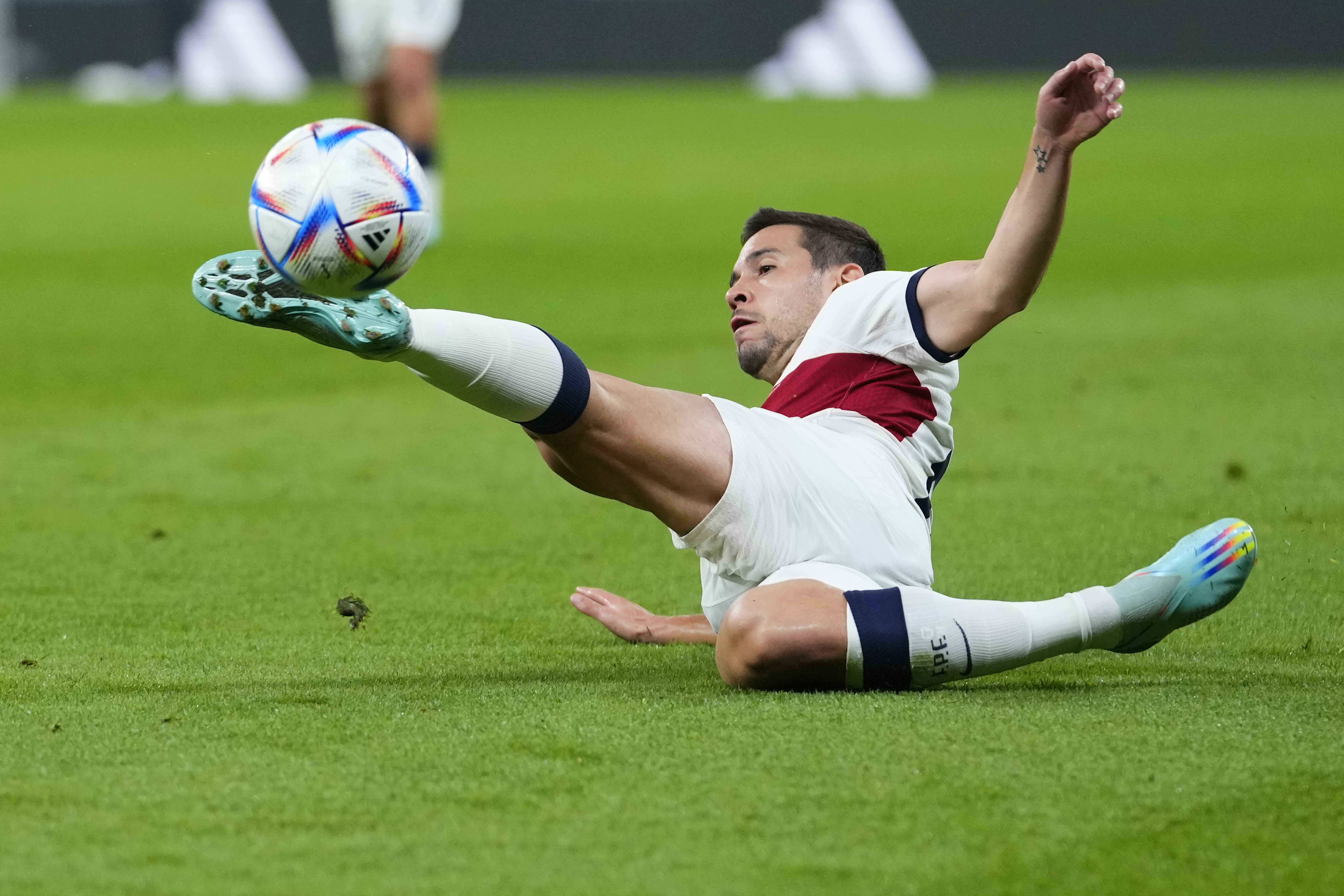 Portugal's Raphael Guerreiro controls the ball during the World Cup quarterfinal soccer match between Morocco and Portugal, at Al Thumama Stadium in Doha, Qatar, Saturday, Dec. 10, 2022. (AP Photo/Petr David Josek)