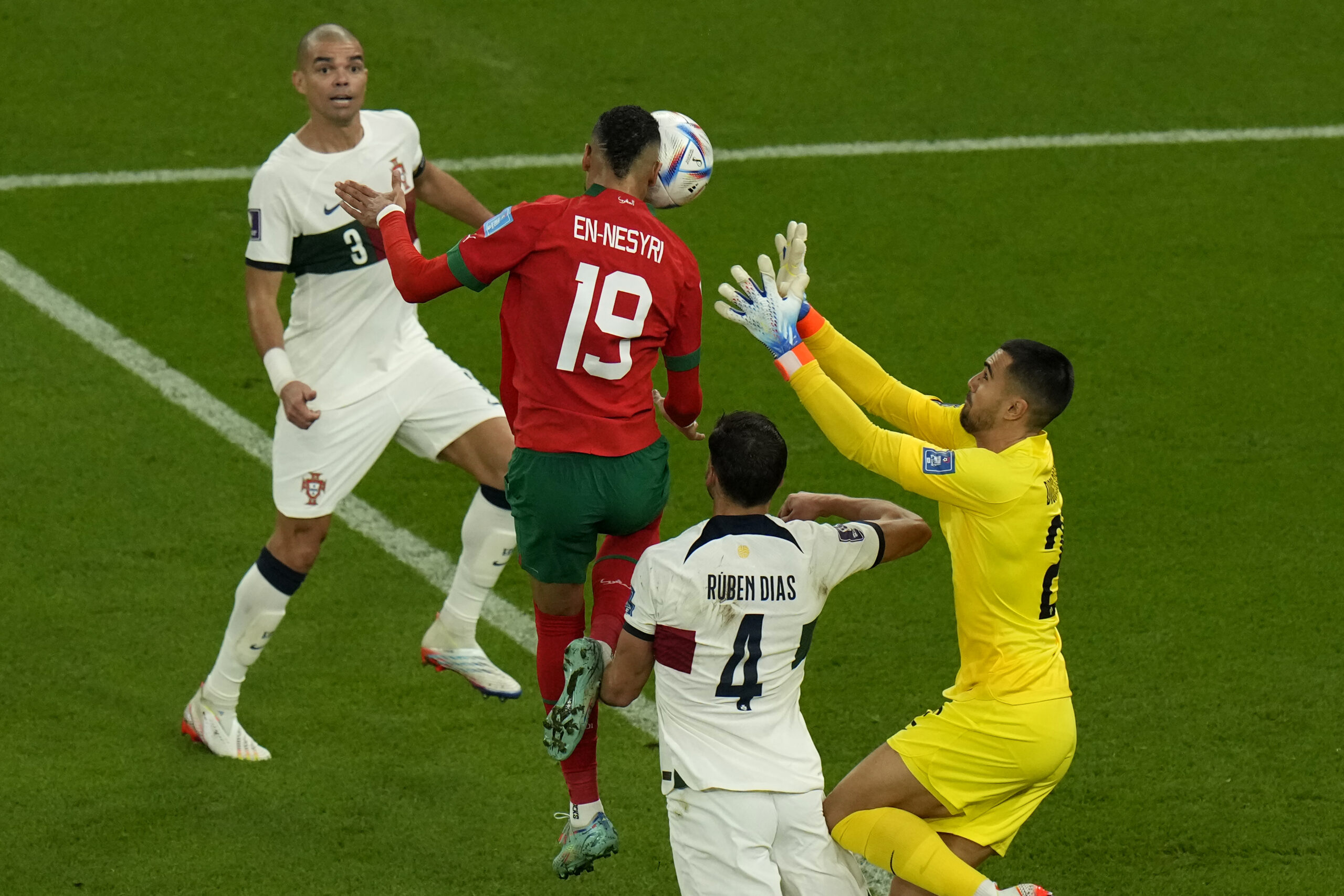 Morocco's Youssef En-Nesyri (19) heads the ball to score his side's opening goal during the World Cup quarterfinal soccer match between Morocco and Portugal, at Al Thumama Stadium in Doha, Qatar, Saturday, Dec. 10, 2022. (AP Photo/Alessandra Tarantino)