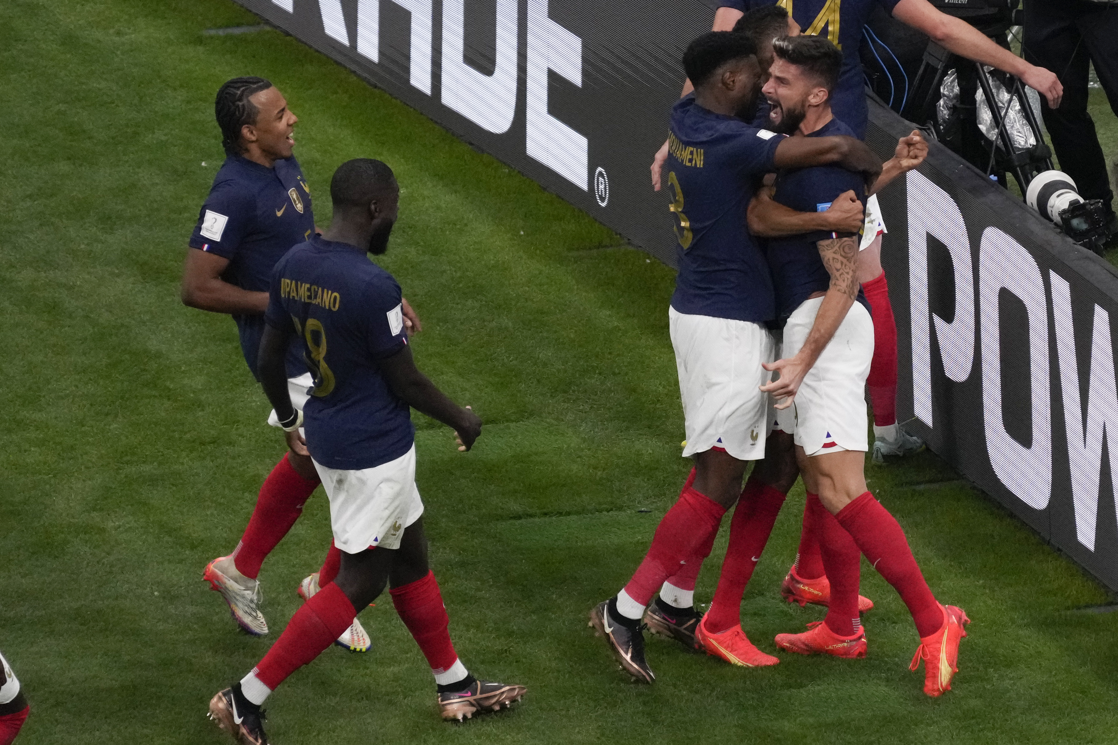 France's Olivier Giroud. Right, celebrates after he scored during the World Cup quarterfinal soccer match between England and France, at the Al Bayt Stadium in Al Khor, Qatar, Saturday, Dec. 10, 2022. (AP Photo/Darko Bandic)