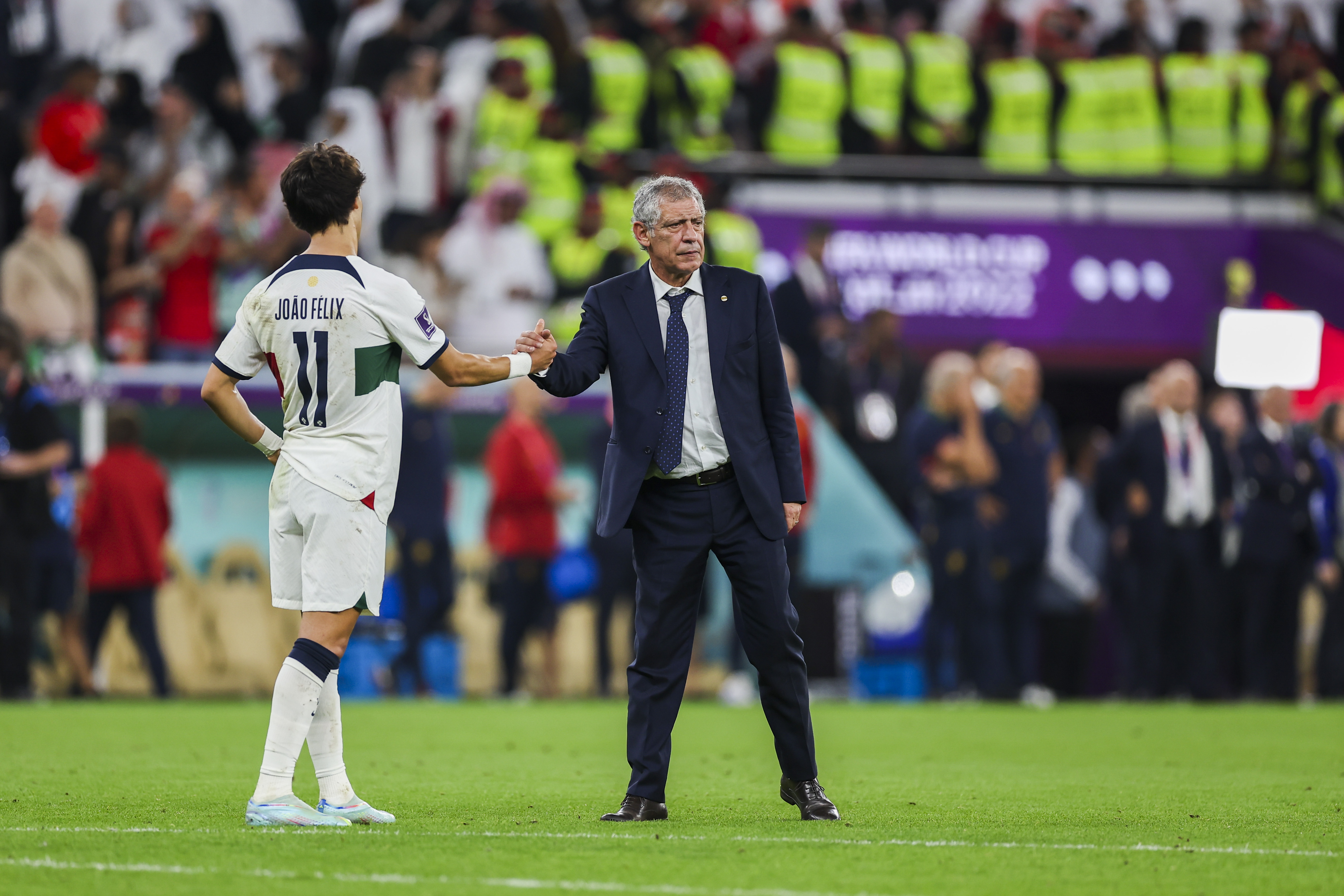 epa10359743 Head coach of Portugal Fernando Santos (R) and his player Joao Felix react after the FIFA World Cup 2022 quarter final soccer match between Morocco and Portugal at Al Thumama Stadium in Doha, Qatar, 10 December 2022.  EPA-EFE/JOSE SENA GOULAO