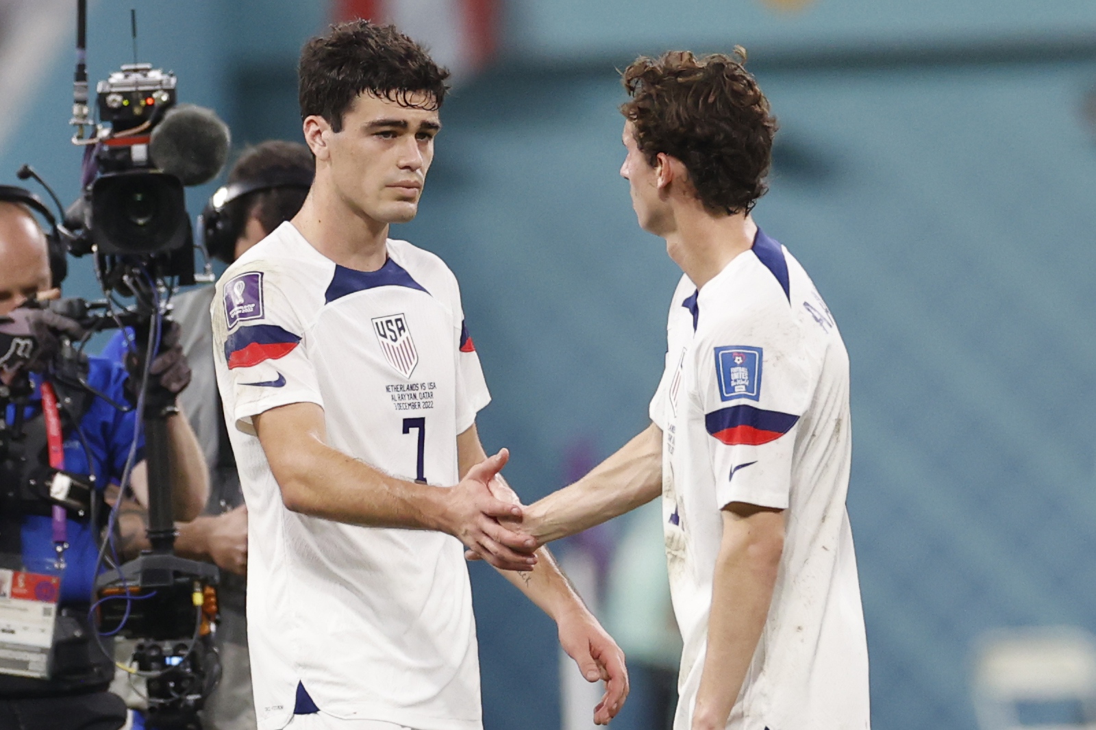 epa10346521 Giovanni Reyna (L) and Brenden Aaronson of the US react after the FIFA World Cup 2022 round of 16 soccer match between the Netherlands and the USA at Khalifa International Stadium in Doha, Qatar, 03 December 2022.  EPA-EFE/Rungroj Yongrit