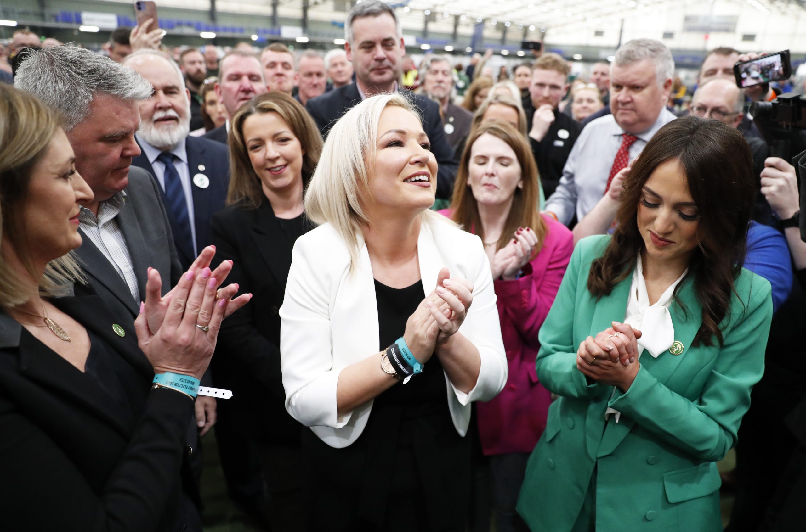 Sinn Fein's Vice President Michelle O'Neill, centre, reacts with party colleagues after being elected in Mid Ulster at the Medow Bank election count centre in Magherafelt , Northern Ireland, Friday, May, 6, 2022. (AP Photo/Peter Morrison)