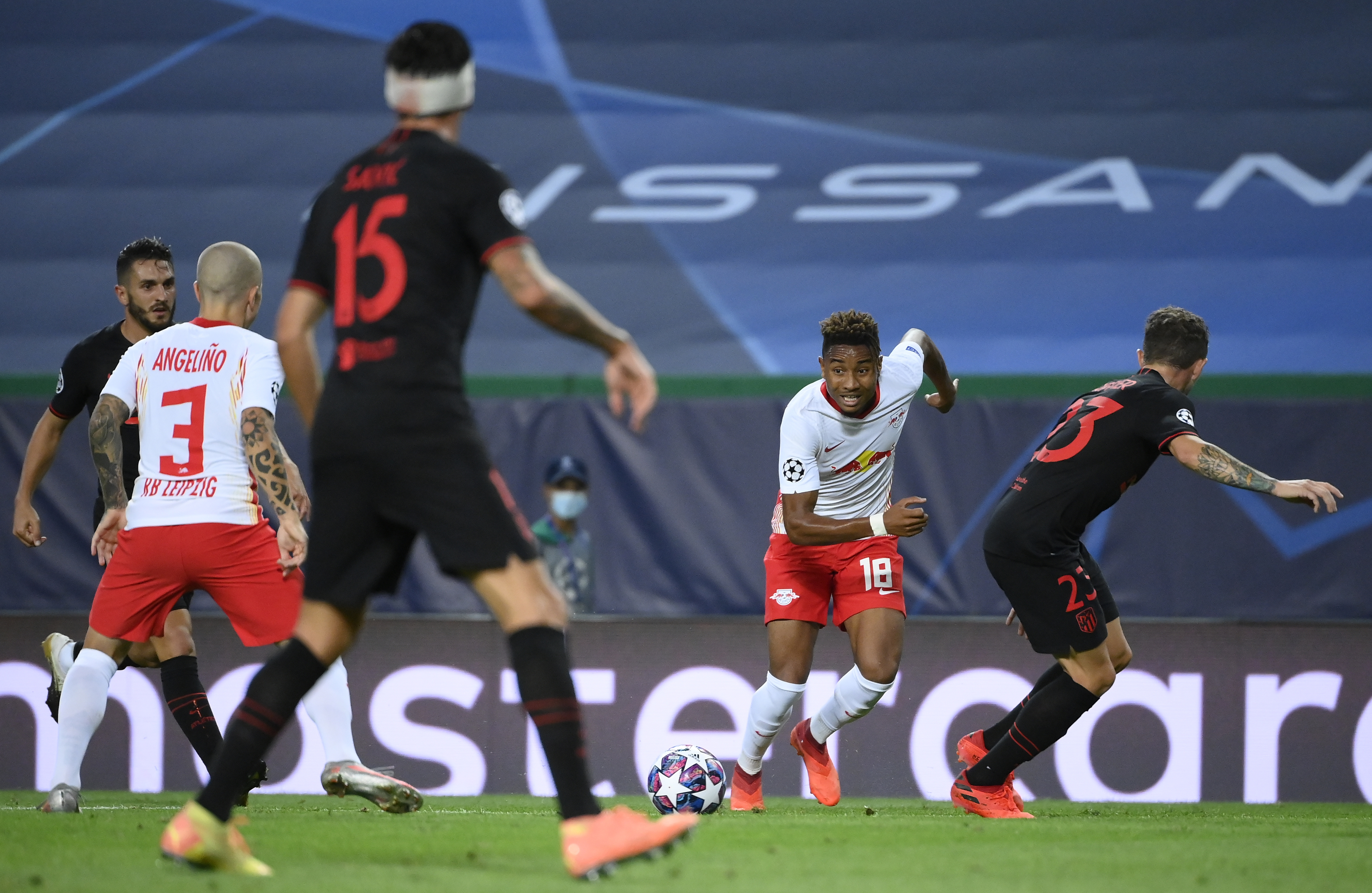 epa08601811 Christopher Nkunku (2-R) of Leipzig in action against of Atletico during the UEFA Champions League quarter final match between RB Leipzig and Atletico Madrid in Lisbon, Portugal, 13 August 2020.  EPA-EFE/Lluis Gene / POOL
