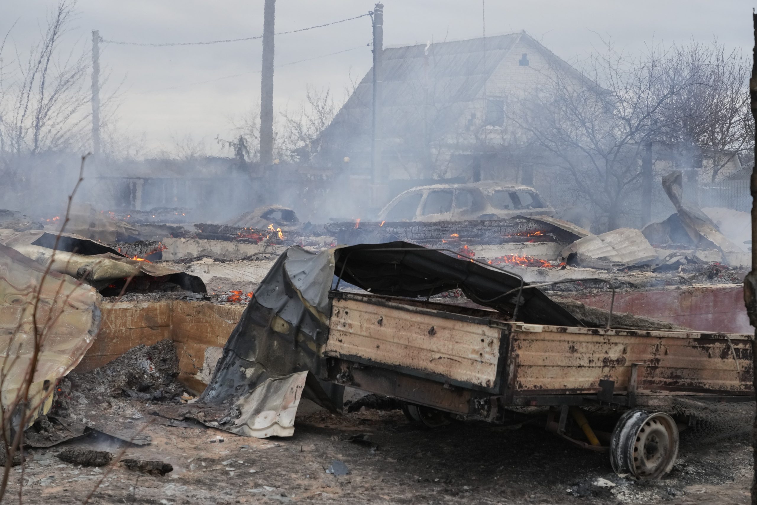 The debris of a privet house in the aftermath of Russian shelling outside Kyiv, Ukraine, Thursday, Feb. 24, 2022. Russia on Thursday unleashed a barrage of air and missile strikes on Ukrainian facilities across the country. (AP Photo/Efrem Lukatsky)