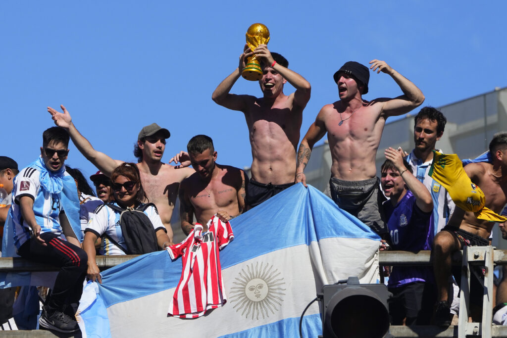 Soccer fans welcome home the Argentine soccer team after it won the World Cup tournament in Buenos Aires, Argentina, Tuesday, Dec. 20, 2022. (AP Photo/Natacha Pisarenko)