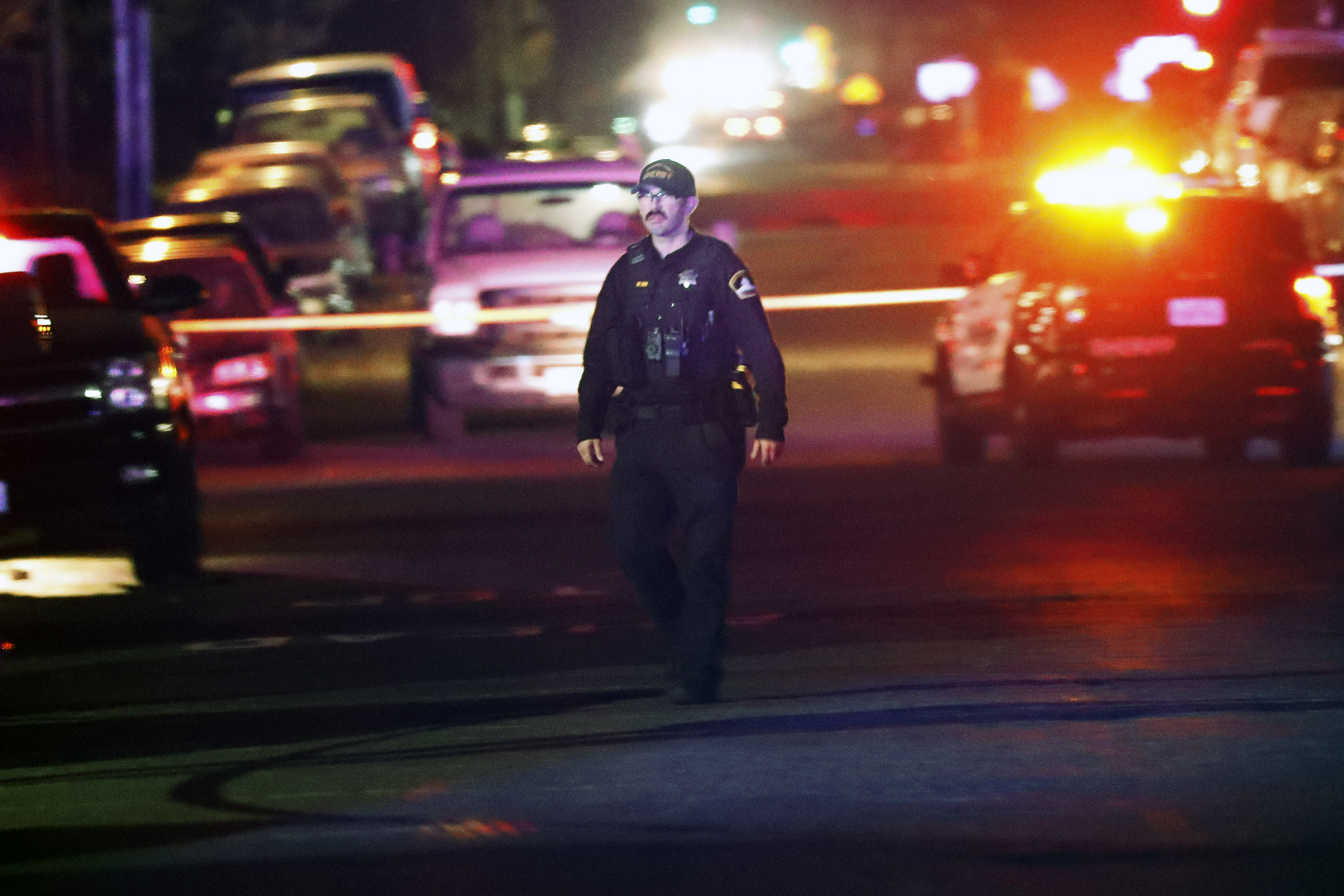 epa09793005 A Sacramento County Sheriff stands in front of The Church of Sacramento, where a father shot and killed his three daughters, before killing himself and another person, in Sacramento, California, USA, 28 February 2022.  EPA-EFE/JOHN G. MABANGLO