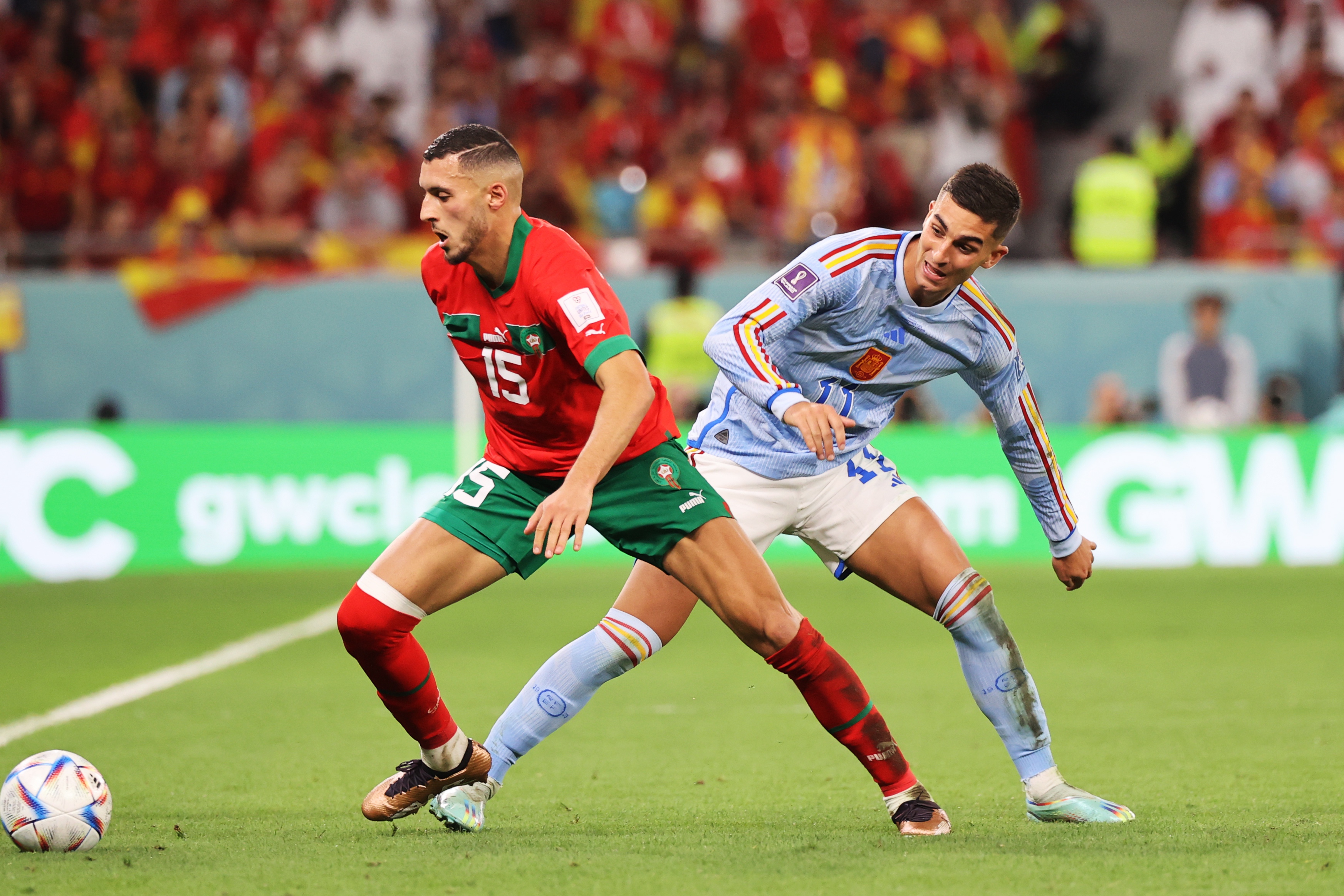 epa10352119 Selim Amallah of Morocco (L) in action against Ferran Torres of Spain during the FIFA World Cup 2022 round of 16 soccer match between Morocco and Spain at Education City Stadium in Doha, Qatar, 06 December 2022.  EPA-EFE/Mohamed Messara