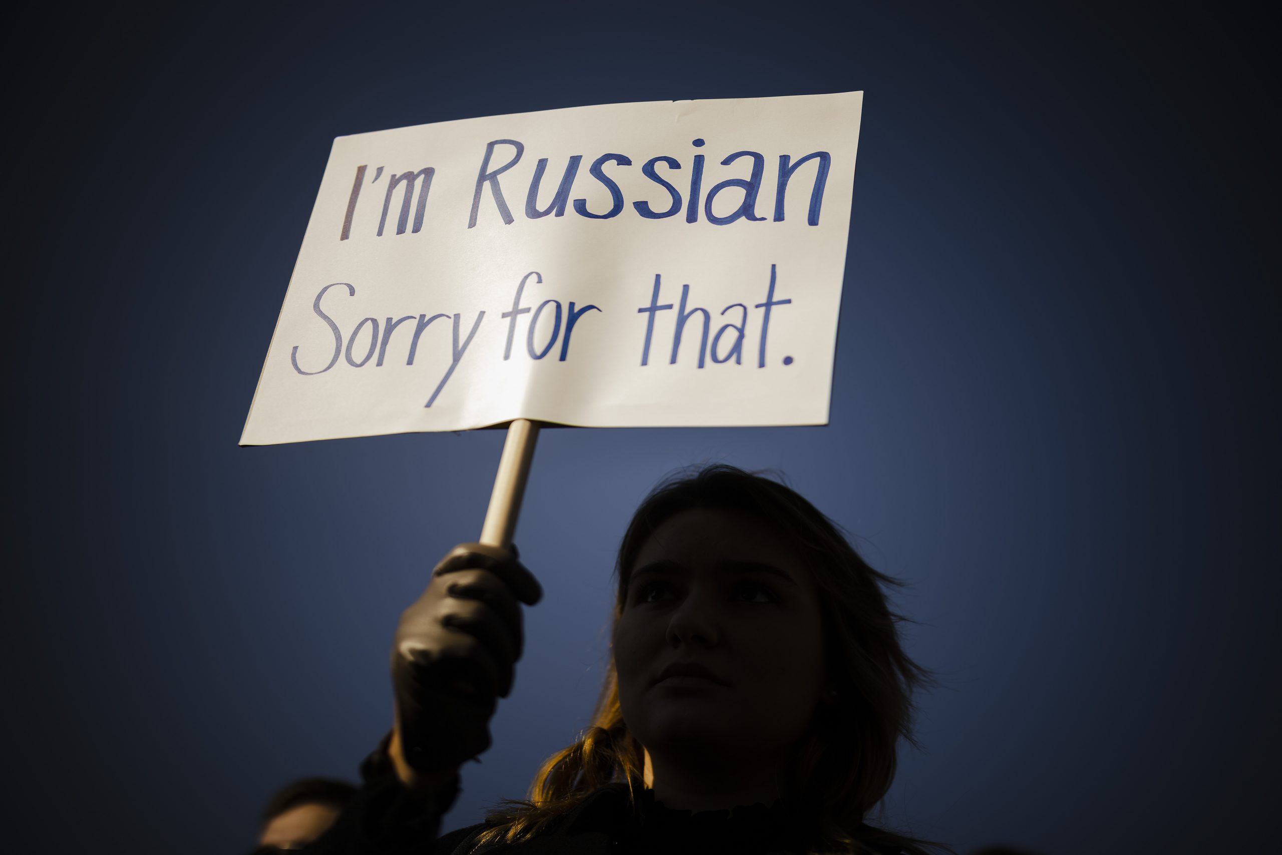 epaselect epa09803342 A woman holds a placard during a rally against the Russian invasion of Ukraine, in Zurich, Switzerland, 05 March 2022.  EPA-EFE/MICHAEL BUHOLZER
