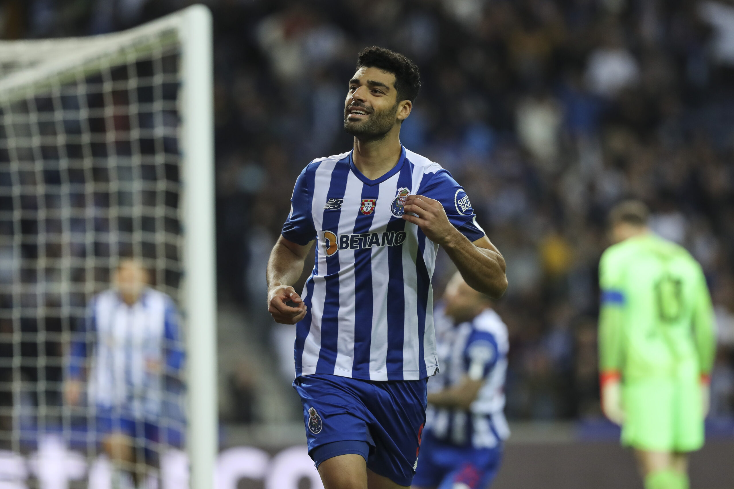epa10279487 FC Porto's Mehdi Taremi celebrates after scoring the 1-0 lead during the Champions League group B soccer match between FC Porto and Atletico Madrid, in Porto, Portugal, 01 November 2022.  EPA-EFE/JOSE COELHO
