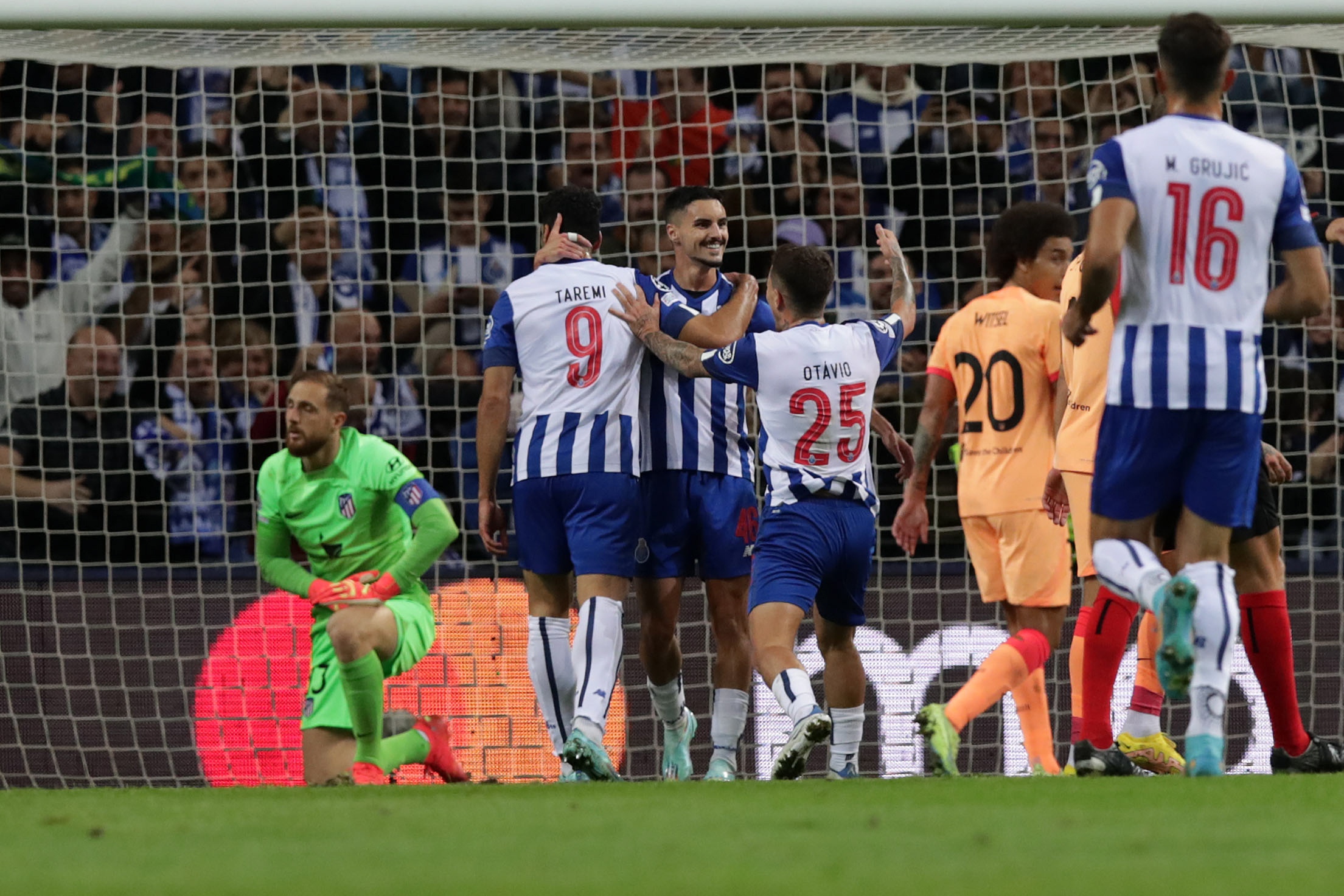 epa10279522 FC Porto's Stephen Eustaquio (C) celebrates after scoring the 2-0 goal during the Champions League group B soccer match between FC Porto and Atletico Madrid, in Porto, Portugal, 01 November 2022.  EPA-EFE/ESTELA SILVA