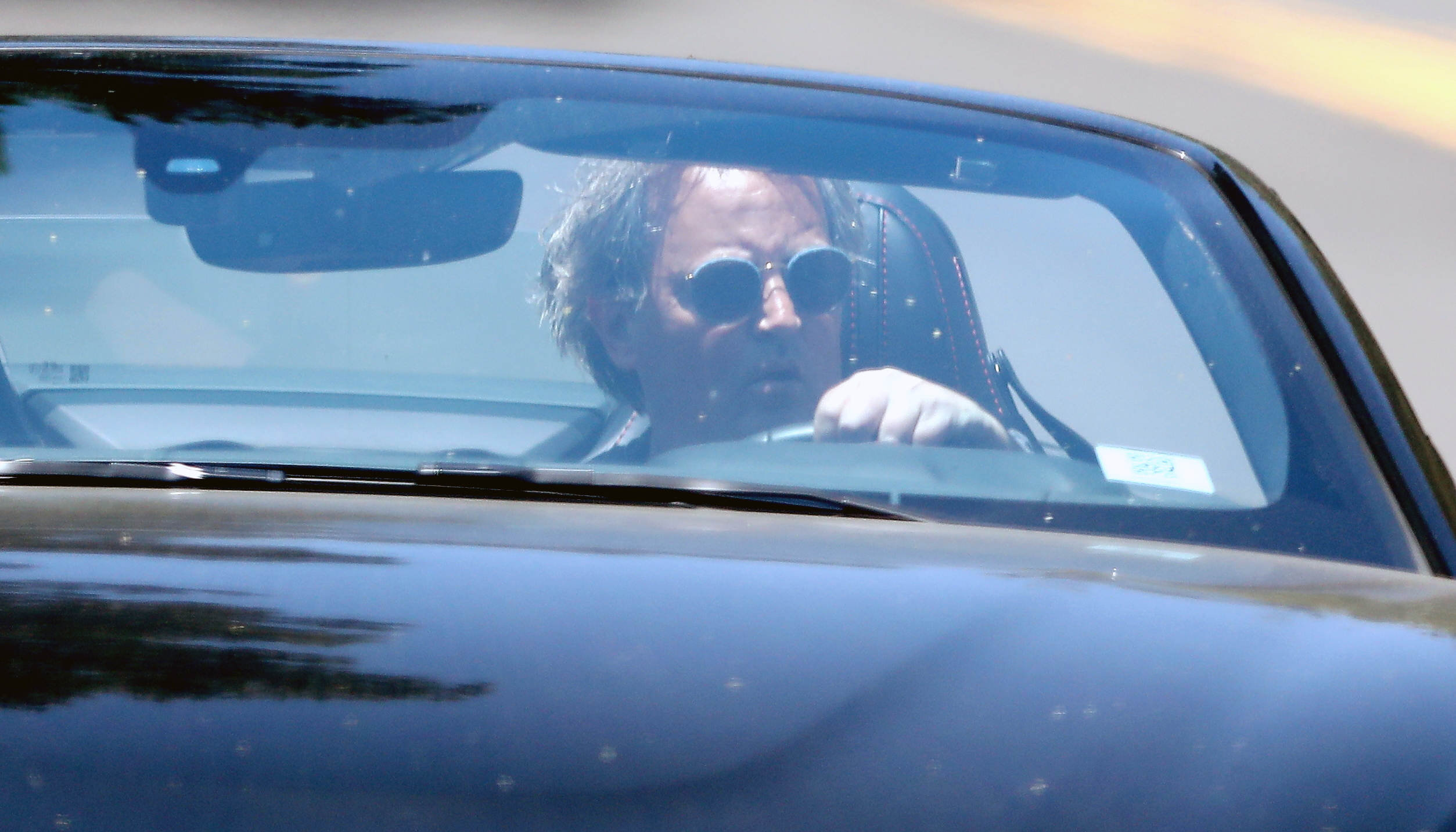 Matthew Perry channels his inner James Bond as he cruises through LA on Memorial Day driving a brand new Aston Martin sports car.