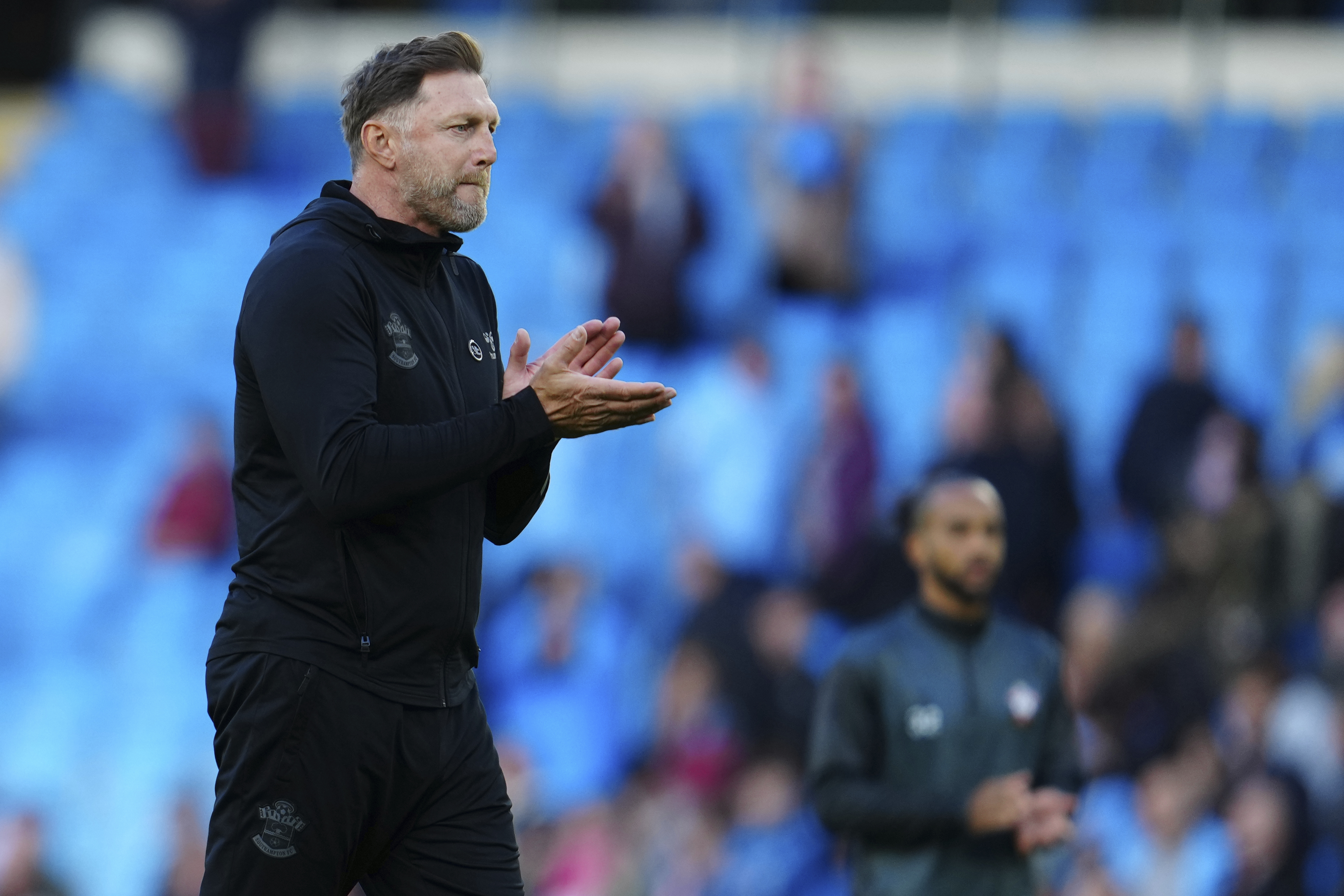 Southampton's manager Ralph Hasenhuettl applauds after the English Premier League soccer match between Manchester City and Southampton at Etihad stadium in Manchester, England, Saturday, Oct. 8, 2022. (AP Photo/Jon Super)