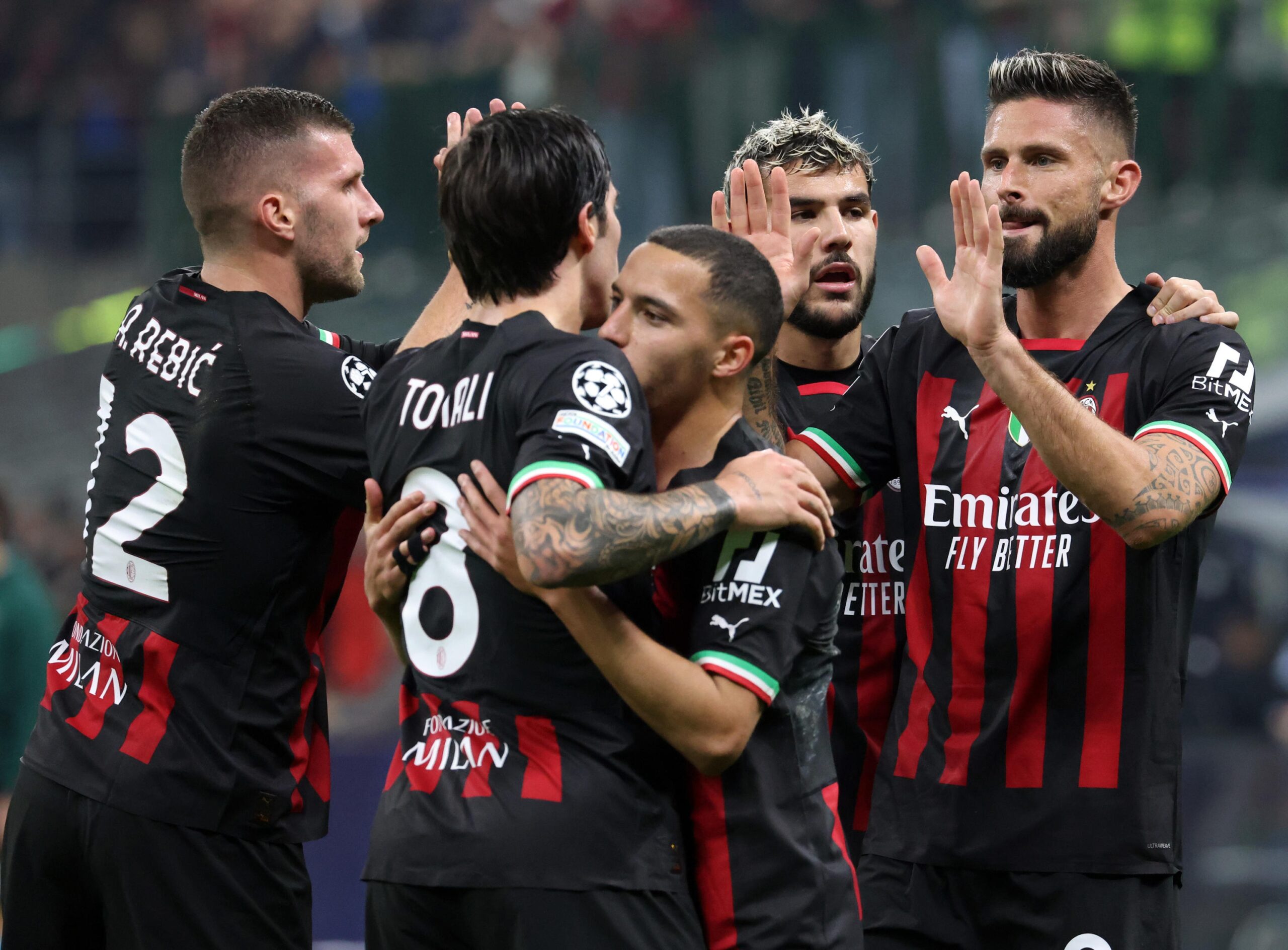 epa10282363 AC Milan's Olivier Giroud (R) celebrates with his teammates after scoring the 1-0 goal during he UEFA Champions League group E soccer match between AC Milan and FC Salzburg, in Milan, Italy, 02 November 2022.  EPA-EFE/MATTEO BAZZI