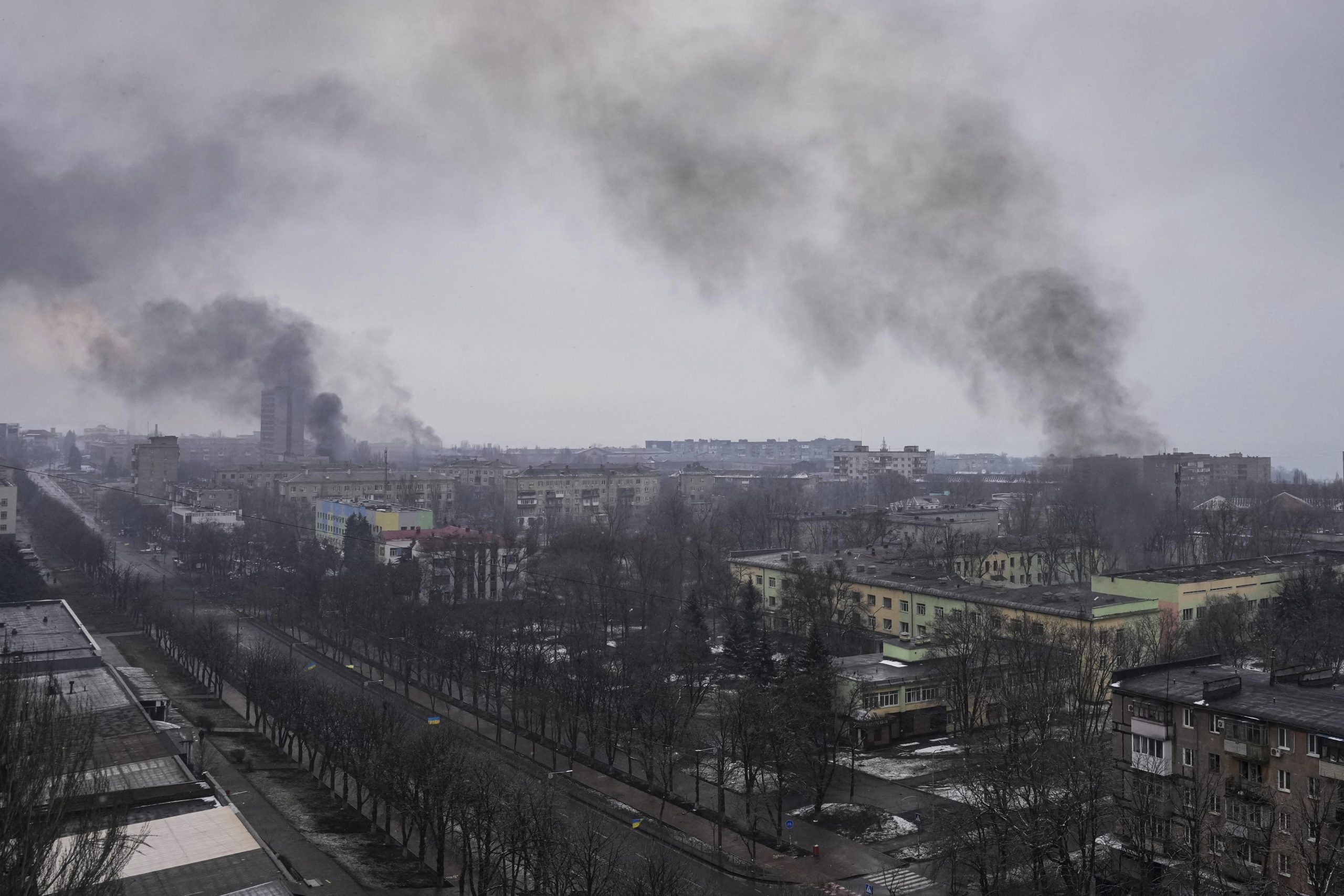 Smoke rise after shelling in Mariupol, Ukraine, Wednesday, March 9, 2022. A Russian attack has severely damaged a maternity hospital in the besieged port city of Mariupol, Ukrainian officials say. (AP Photo/Evgeniy Maloletka)