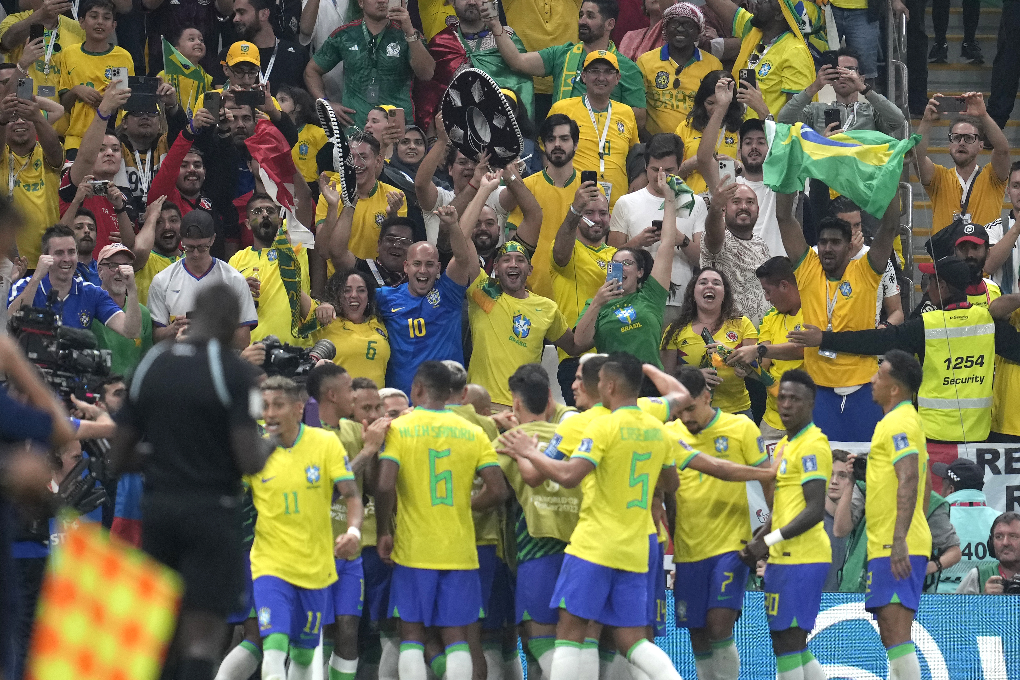 Brazil players celebrate after Brazil's Richarlison scored his side's second goal during the World Cup group G soccer match between Brazil and Serbia, at the Lusail Stadium in Lusail, Qatar, Thursday, Nov. 24, 2022. (AP Photo/Natacha Pisarenko)