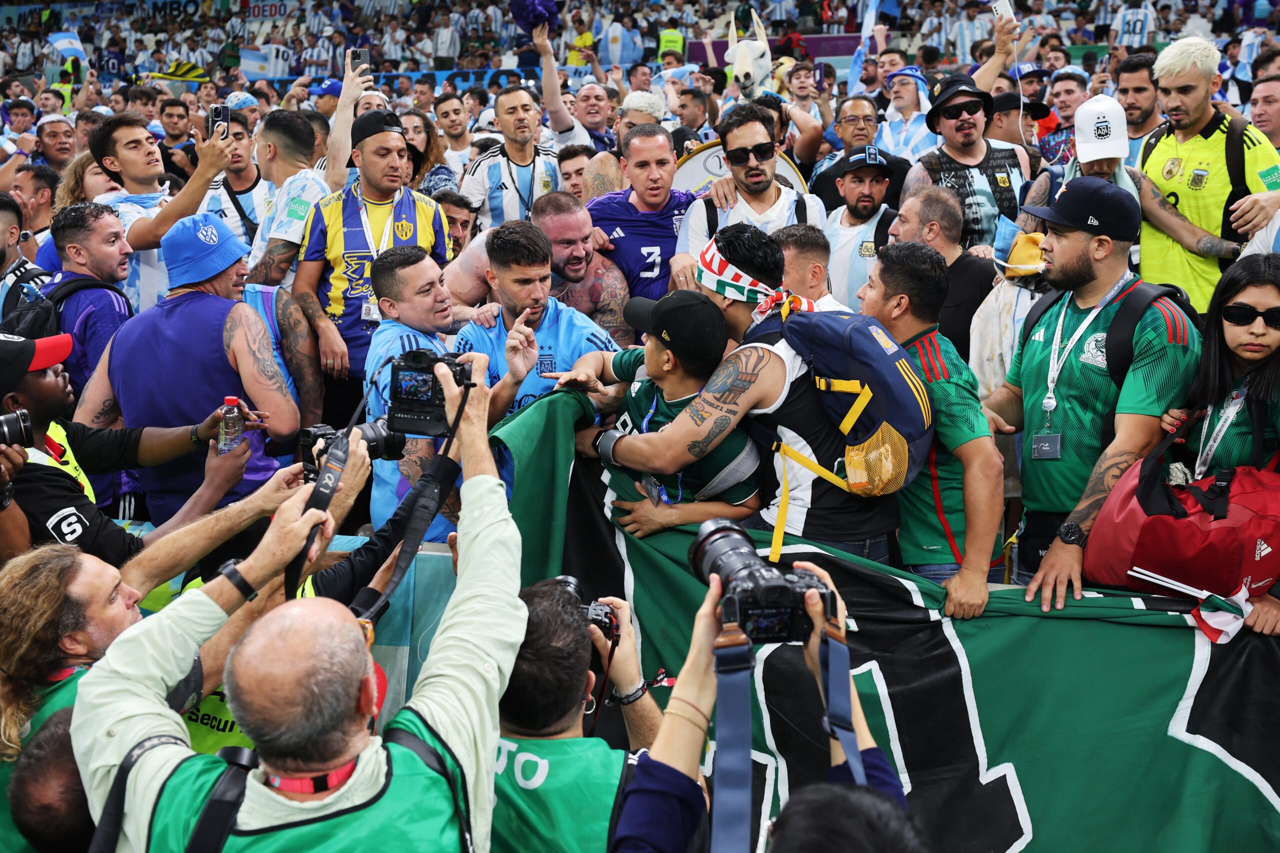 epa10330922 Fans of Argentina (blue) encounter in the stands with fans of Mexico (green) before the FIFA World Cup 2022 group C soccer match between Argentina and Mexico at Lusail Stadium in Lusail, Qatar, 26 November 2022.  EPA-EFE/Mohamed Messara