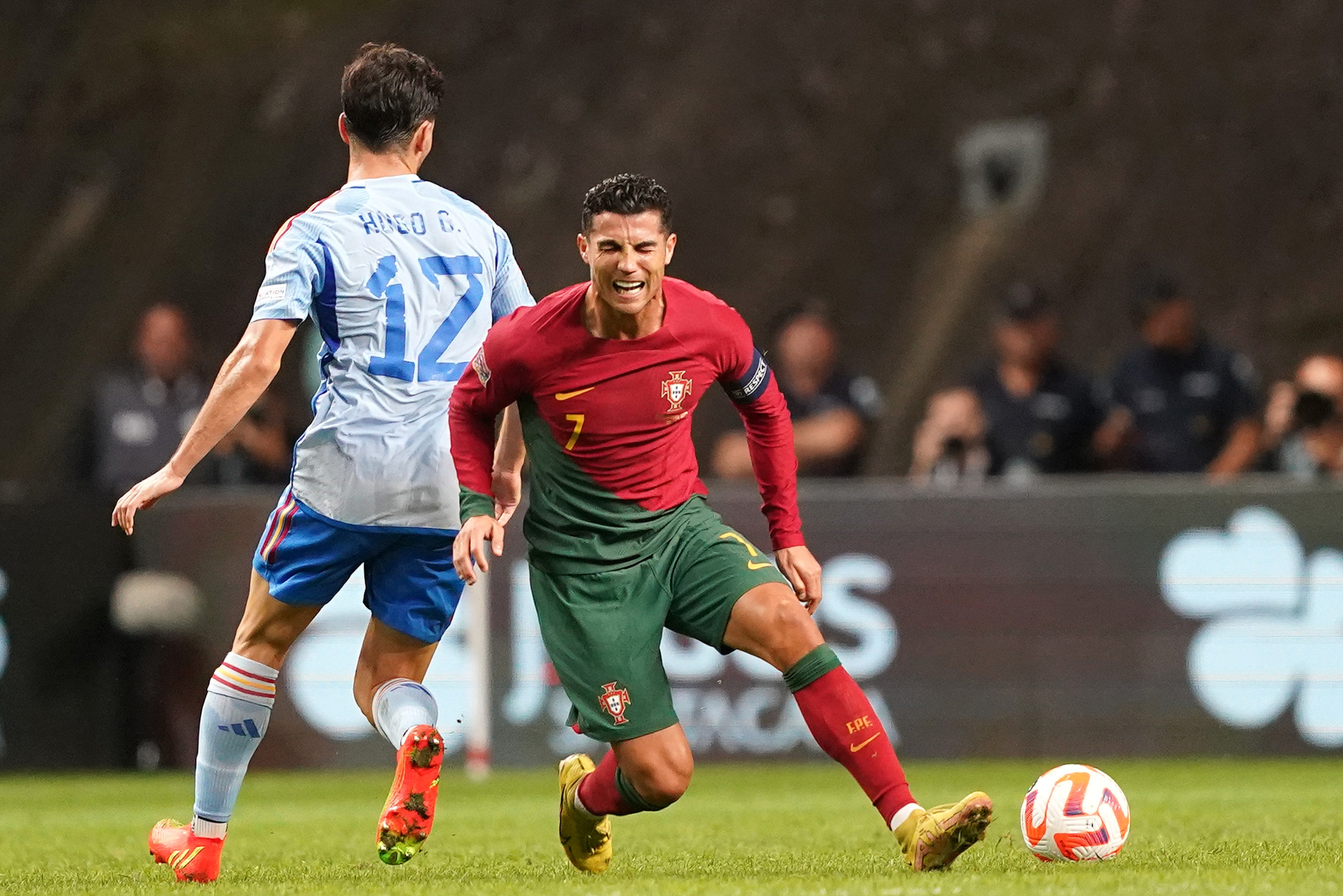 epa10210263 Portugal player Cristiano Ronaldo (R) in action against Spain player Hugo Guillamon during the UEFA Nations League soccer match between Portugal and Spain at the Municipal stadium in Braga, Portugal, 27 September 2022.  EPA-EFE/HUGO DELGADO